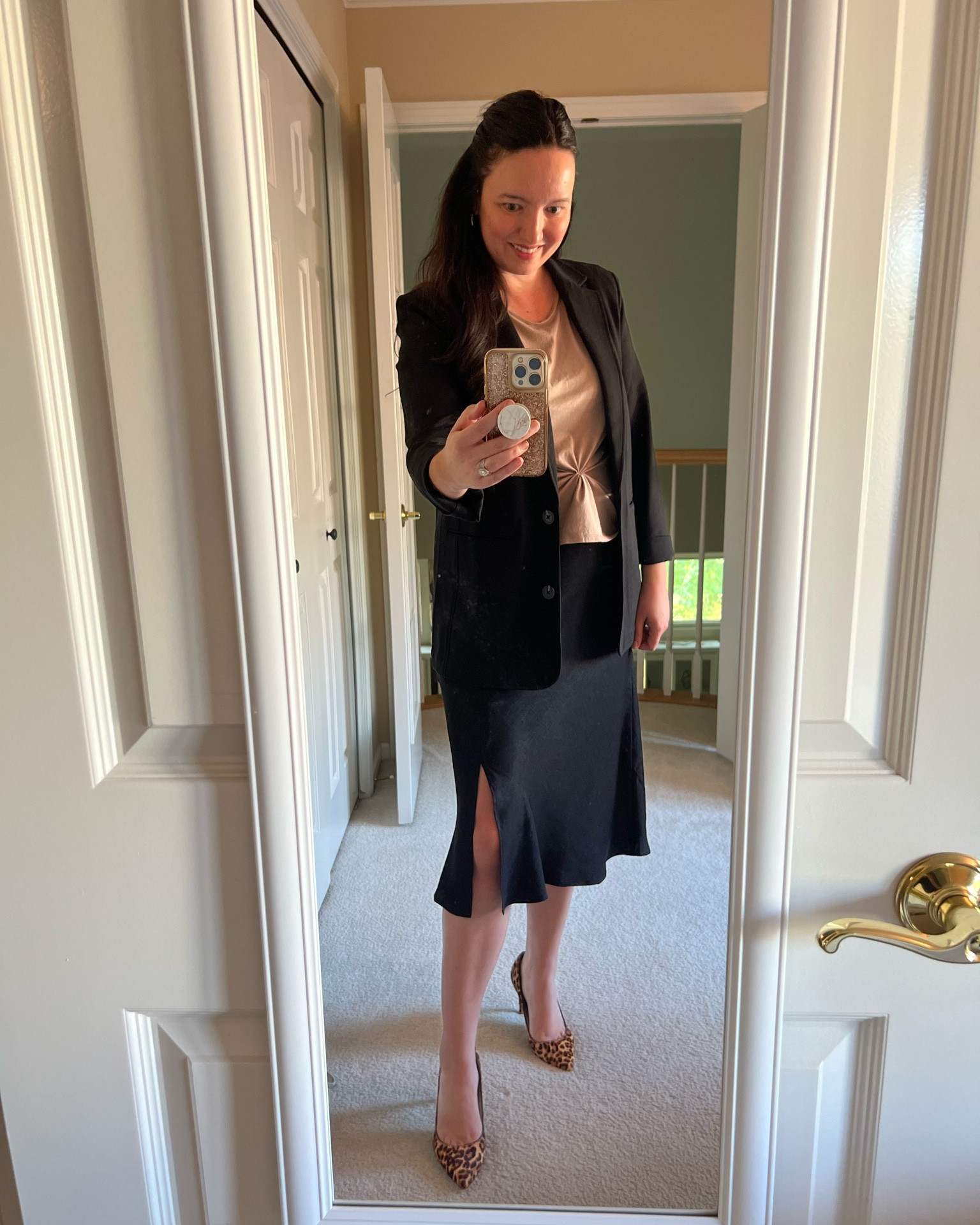 Super chic satin skirt from Walmart! Runs TTS - wearing a medium.  Comes in several colors!  Also love this ponte blazer from Gap - super stretchy and comfortable - oversized/larger fit, I sized down to a small. 

Easy tip for elevating a t-shirt - wrap a small section underneath in the middle with a hair tie and voila, you have made the shirt shorter and have added flattering detail.

#LTKworkwear #LTKstyletip #LTKmidsize