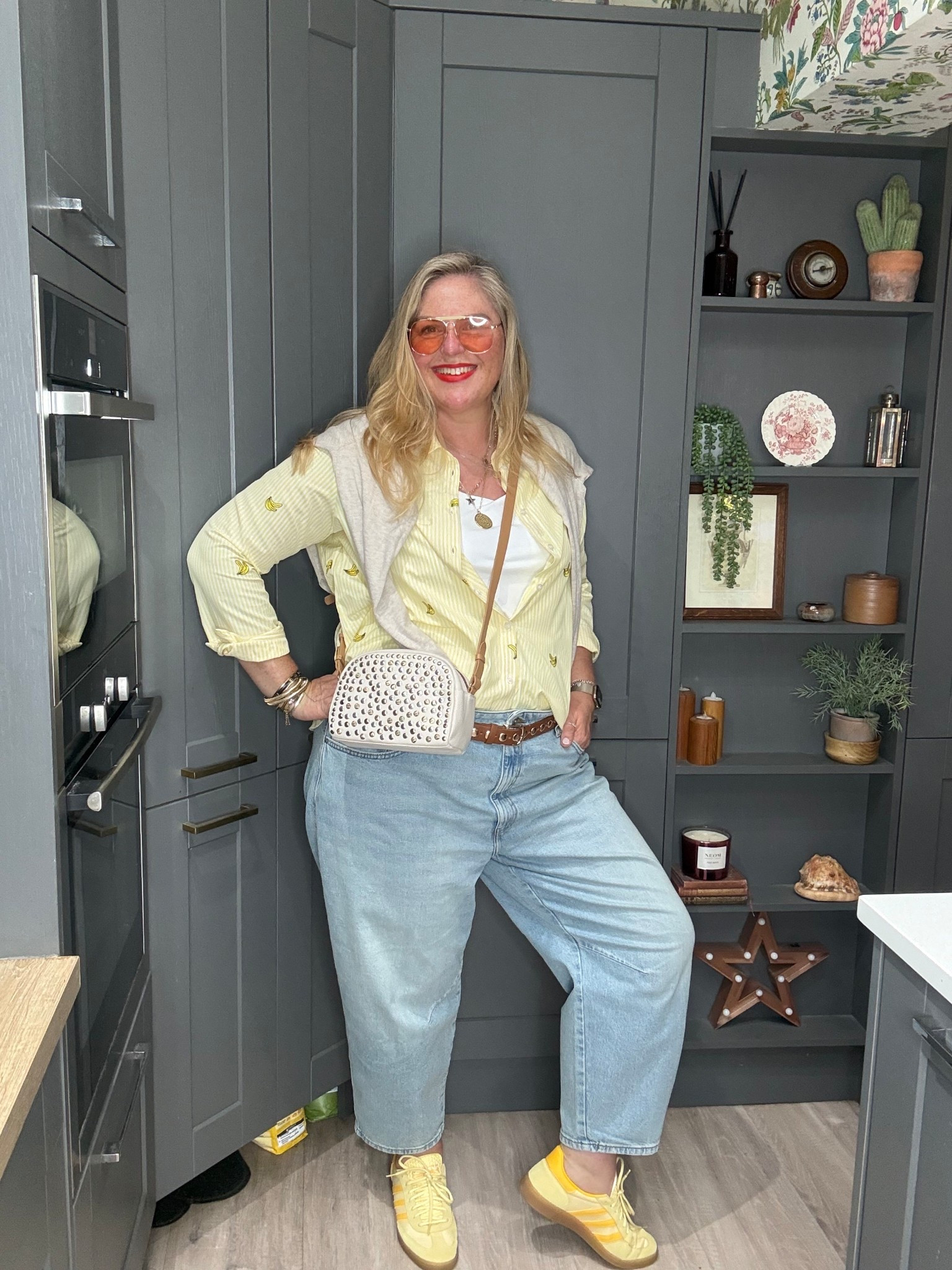 Yellow stripe shirt, barrel jeans, white vest, stuffed bag, yellow trainers, sunglasses 

#LTKjeans #LTKplussize #LTKsummer