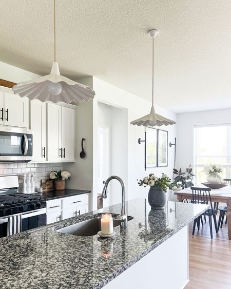 This is the prettiest pendant light! It’s made of bone china and definitely makes a statement. 

Lighting, kitchen, vases, faux floral, dining room table, kitchen pendants 

#LTKstyletip #LTKhome #LTKFind