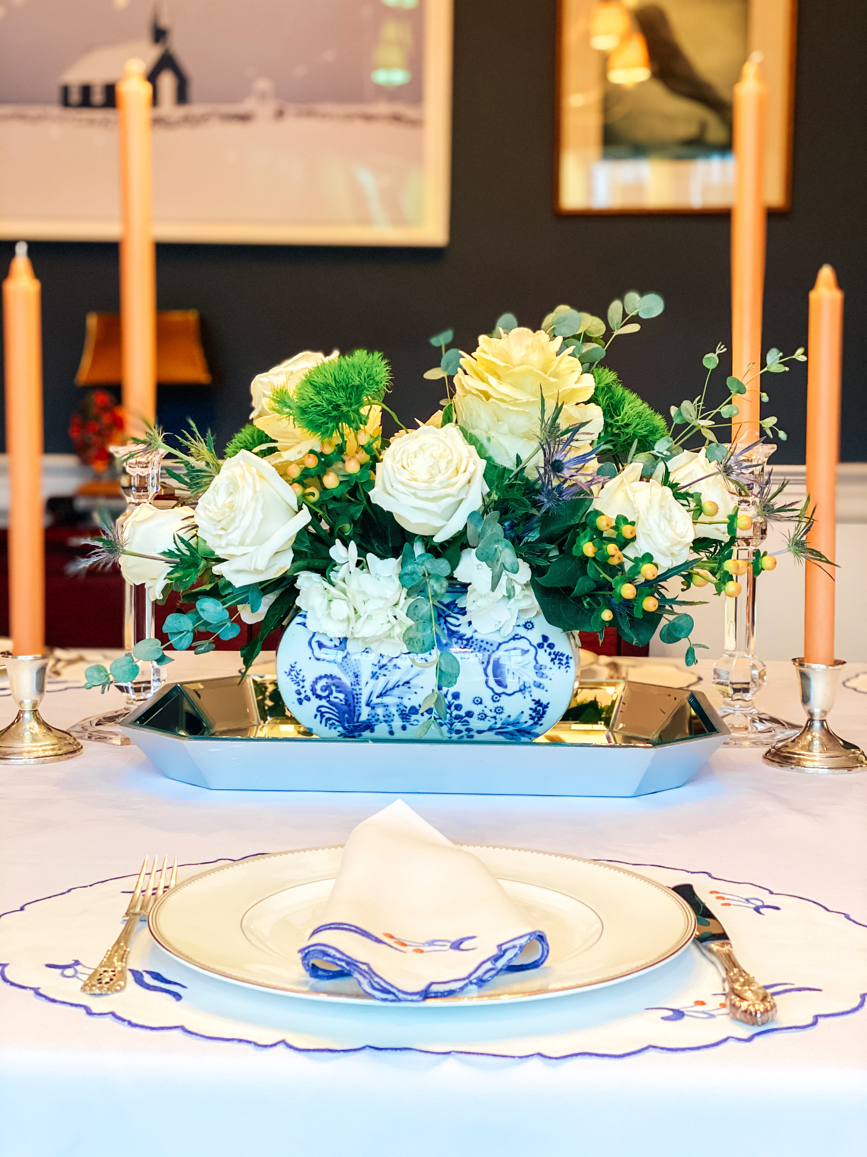 Set the stage for an unforgettable Thanksgiving feast with this elegant tablescape featuring chinoiserie accents, silver candlesticks, and peach candles. The white table linens, blue and peach patterned placemats and napkins, and vintage-inspired ginger jar centerpiece create a timeless, autumnal look perfect for Thanksgiving dinner. We've recreated this Thanksgiving table setting using items found on Amazon to make it easy to achieve. Whether hosting an intimate gathering or a larger Thanksgiving celebration, this Thanksgiving tablescape exudes elegance and warmth. Recreate this look for your holiday table using a mix of traditional and modern elements.  

 #LTKHoliday #LTKSeasonal #LTKHome