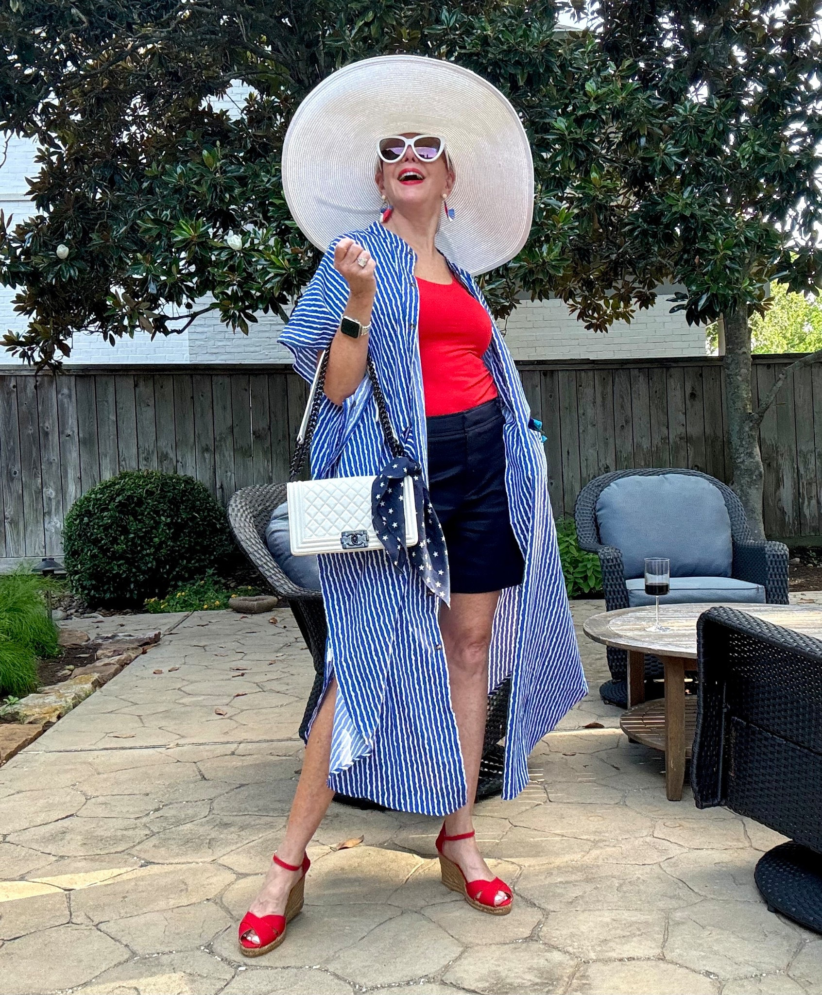Red white and blue Patriotic for 4th of July. 
Red espadrilles 
Navy shorts 
Duster 
Big white wide brimmed hat
White sunglasses 

#LTKFindsUnder50 #LTKStyleTip #LTKOver40