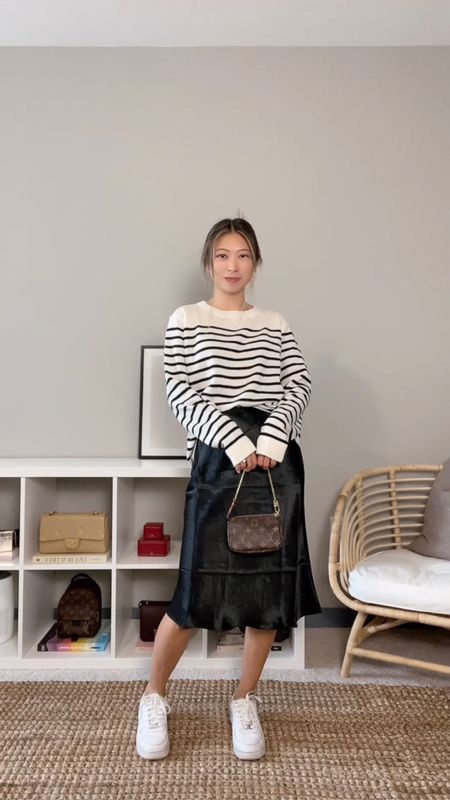Casual parisian chic outfit // Outfit details:⁠ Striped sweater - Reformation, black silk skirt - Aritzia, White sneakers - Nike, Bag - Louis Vuitton⁠ // parisian style, neutral outfits, minimal style 

#LTKunder100 #LTKSeasonal #LTKstyletip