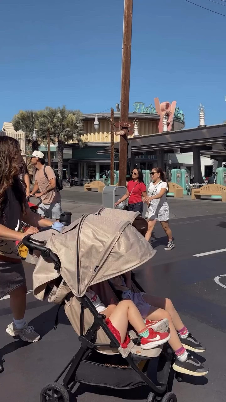 She is beauty, she is grace, she’s @zoestrollers ✨ The Twin stroller was pure Disney magic — we truly wouldn’t have made it through our trip without it. Never thought I’d become a double stroller mom, but it became the star accessory of our @disneyland trip. You guys, the girls napped in it every 👏 single 👏 day thanks to the recline and extra-wide shades, and the storage + pockets carried basically our whole life for long days in the park. It was so easy to maneuver and honestly made those long Disney days feel fun instead of exhausting. I can’t believe I almost convinced myself we didn’t need a stroller — we wouldn’t have had such a magical time without it ✨ love you @zoestrollers!! 🍊