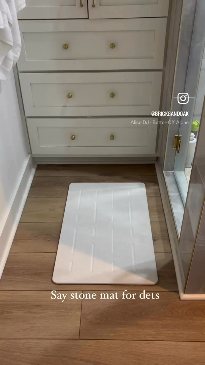 We are a big fan of a stone bath mat! We decided to update our stone bath mat to a larger mat to make getting out easier. Our mat is made of Diatomite which is a ceramic-like material that feels like a natural stone. The mat absorbs water faster than traditional fabric mats,quickly absorbing and evaporating water to ensure your feet are moisture-free, clean, and comfortable. Cleaning the mats are as easy as sanding the stone with the provided sanding pad (which is what we did after moving the the smaller stone mat upstairs). Say “stone mat” and I’ll send you a link to bath mats we use! #stonebathmat #bathmat #stonemat #diatomaceousearth #spabath #spalikebathroom #masterbathroom #primarybathroom #amazondeals #amazonfinds #customhome #dreamhome #dreambathroom 