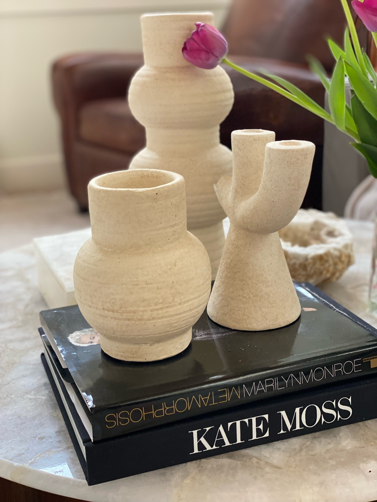 My favorite spot in my home.  Minimalist textured ivory decor, my favorite coffee table books, and the most gorgeous CB2 quartz coffee table. #LTKhome 

#LTKhome #LTKGiftGuide #LTKFind