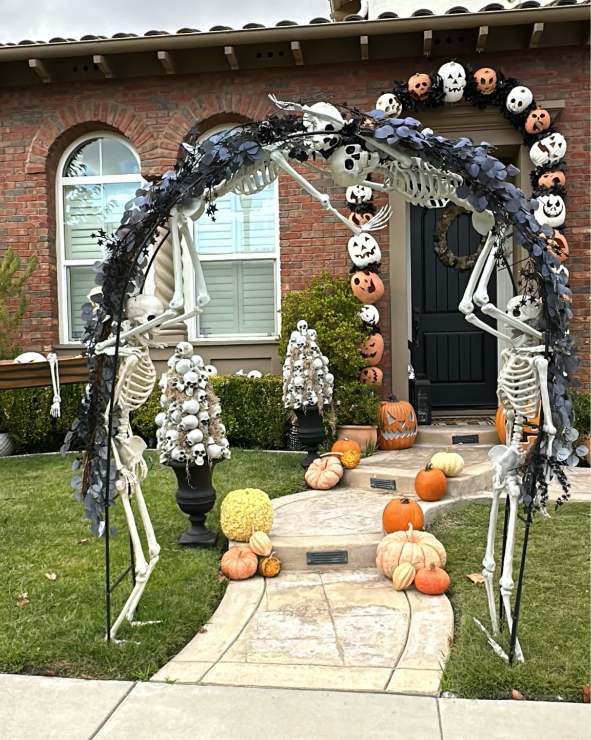 Create a skeleton arch! This is so much easier (and much less expensive than a pumpkin arch!) I already had three skeletons from past decorations. So I bought a garden arch and another skeleton! 

#LTKKids #LTKHalloween #LTKFamily