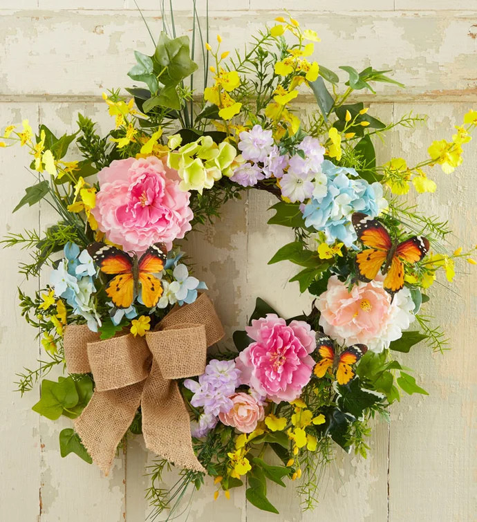 There’s so much beauty to be discovered in our secret garden wreath. Authentic faux spring bloo... | 1800flowers.com