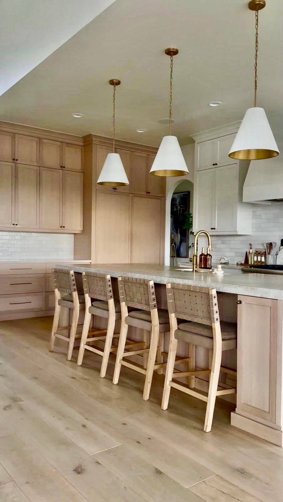 I’m linking the pieces that bring this kitchen together, from the woven counter stools to the brass lighting and warm wood tones. These are the details that create that collected, designer-inspired look I love.

I always gravitate toward timeless materials and soft, natural finishes because they make a space feel warm, elevated, and welcoming every day.
@Wayfair 
@lowes 
@Nathan James

#LTKSaleAlert #LTKU #LTKHome