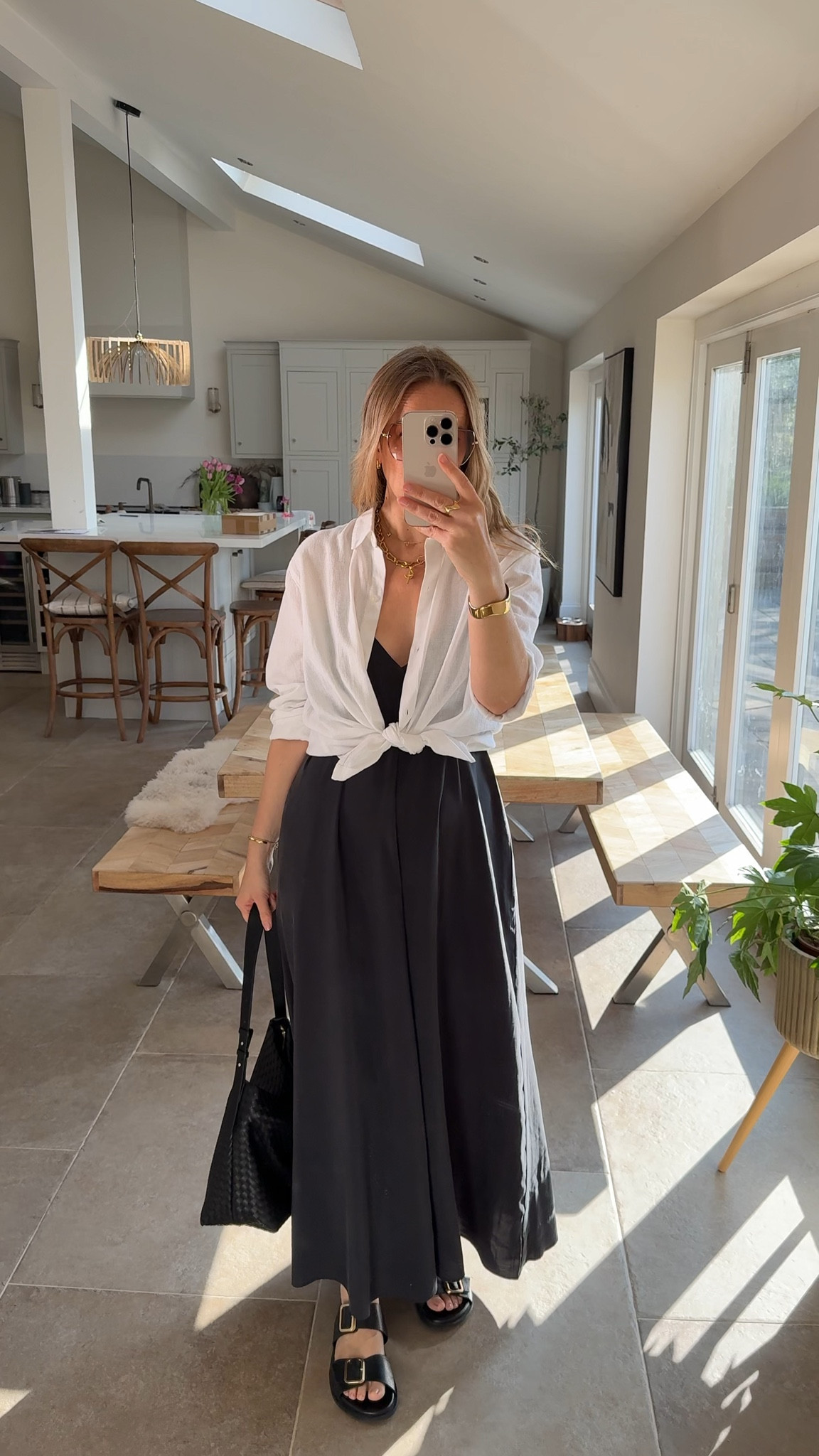 Layering a light linen shirt is a great way to make a strappy dress a little more modest or cover shoulders/arms etc . 
* tip - leave the buttons and tie at the waist for a more relaxed look and some waist shaping. 

Dress - small
Shirt - large 

#LTKspring #LTKtravel #LTKsummer