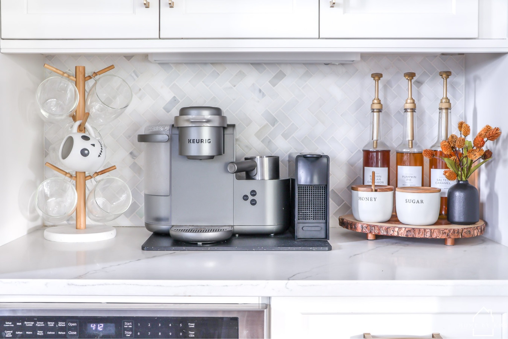 COFFEE BAR | did you see yesterday’s Halloween home tour on the blog?! 👻 The link is in my bio in case you missed it! 
•
Shop my coffee bar setup by clicking the link in my bio or by following me in the @shop.ltk app!
•
•
•
•
#coffeebar #coffeebardecor #coffeecounter #kitchencoffeebar #coffeebarstyling #halloween #halloweencoffeebar #halloweendecor #halloweendecoration #halloweenkitchen #halloween2022 #halloweenhometour #keurig #nespresso #toranisyrup #amazonhome #targetstyle 

#LTKhome #LTKSeasonal #LTKHalloween