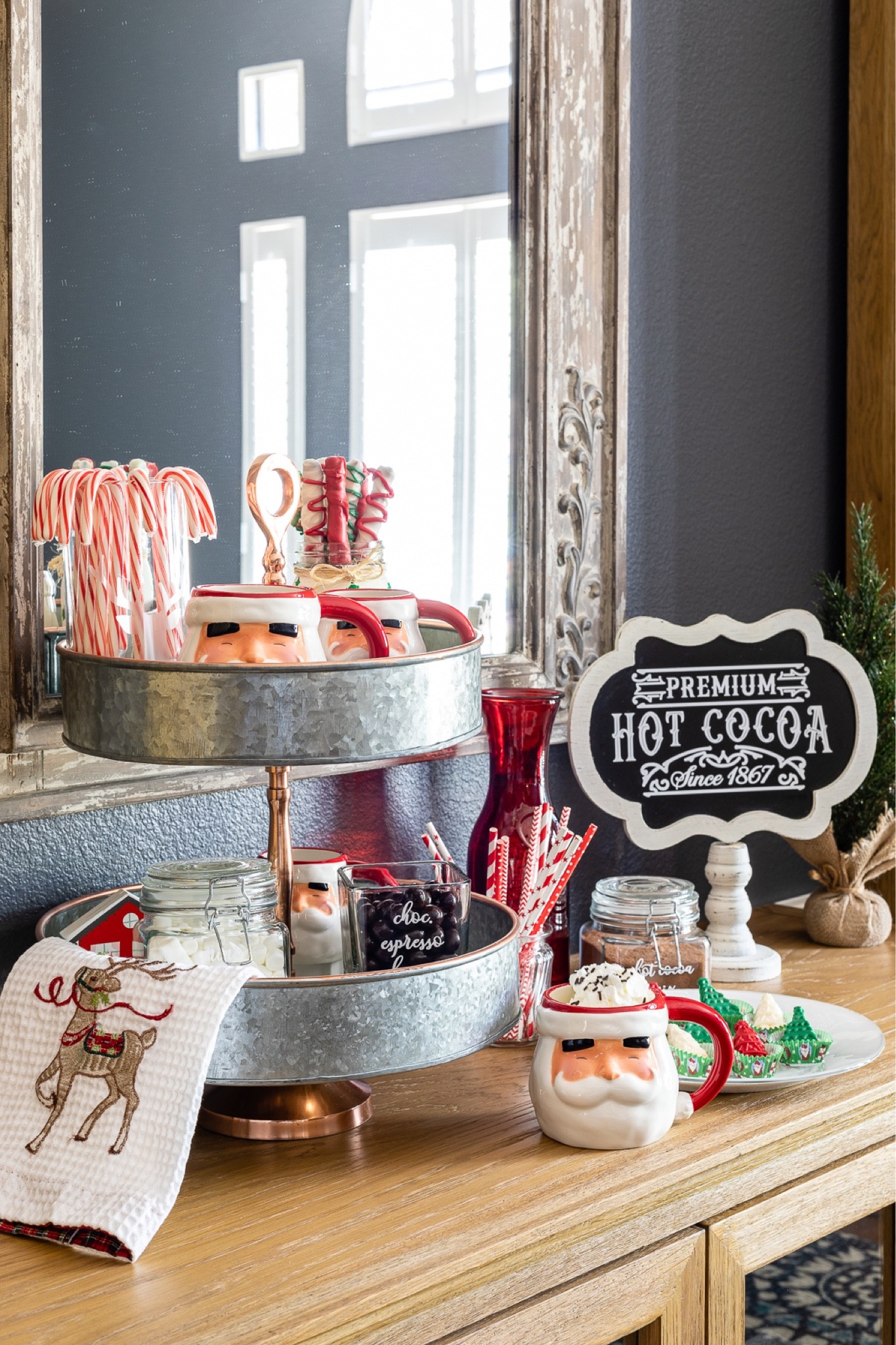 This hot cocoa bar helped my family stay cozy for the Christmas holidays! Santa mugs, chalkboard, signs, and a tiered tray with Christmas towels complete the scene.

#LTKhome #LTKSeasonal #LTKHoliday