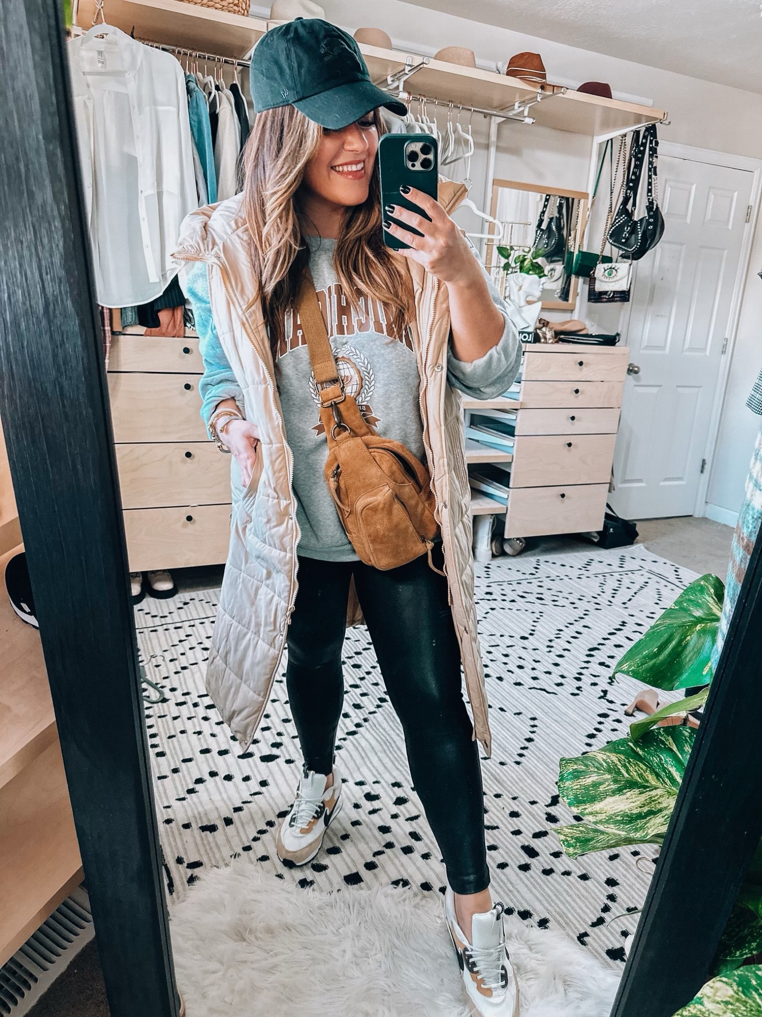 Midsize fashion Fall and winter casual outfit- size 14 faux leather leggings styling •Sweatshirt Amazon xl
•sling bag- curve friendly
•Long puffer vest pink lily 1x - 
(code: 20TARYN)
•Spanx faux leather size up (1x) - (code: TARYNTRULYXSPANX )
•Nike sneakers tts 
•accessories Amazon 

#LTKstyletip #LTKSeasonal #LTKcurves