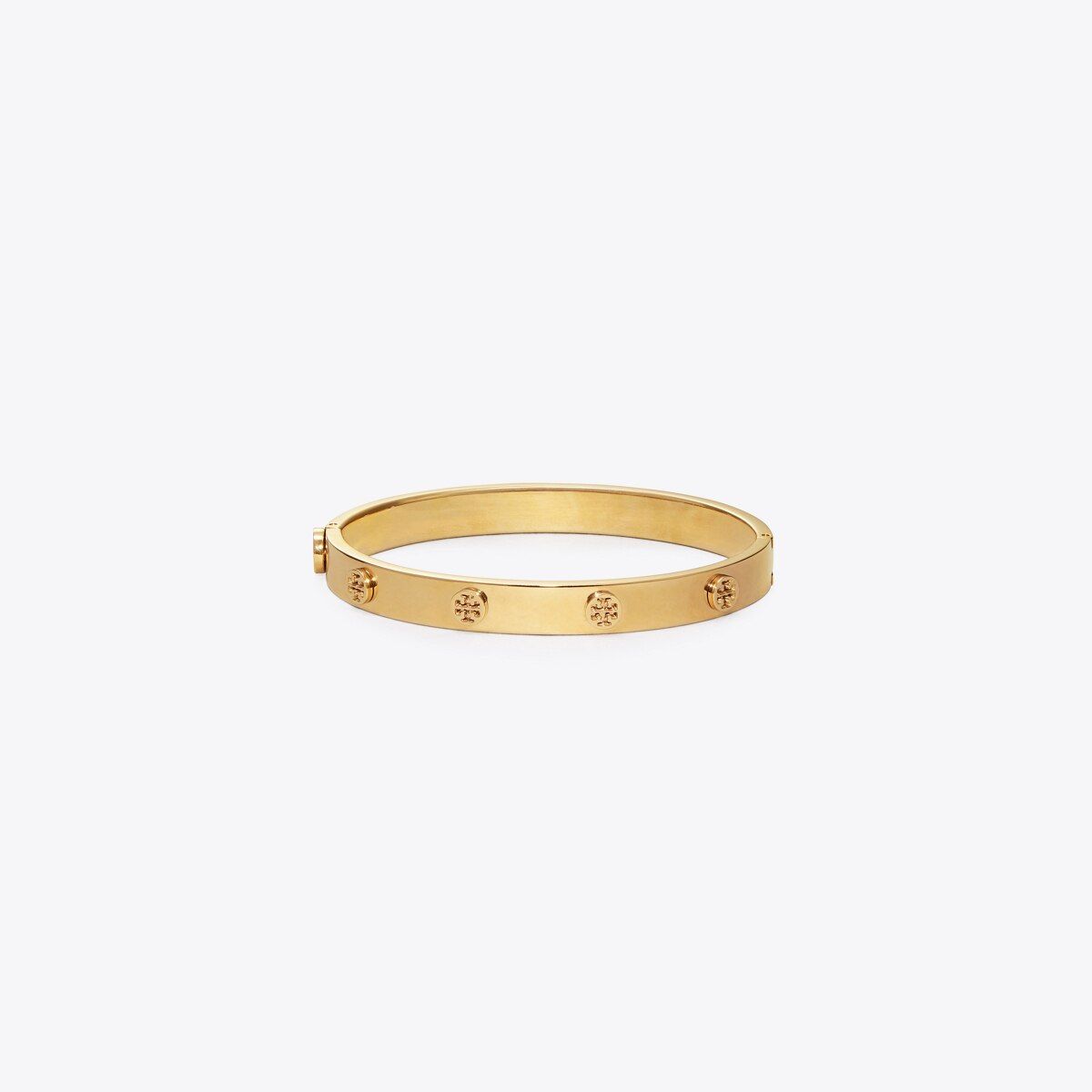 One of our jewelry signatures: the Logo Stud Bracelet, hinged and hard-cast in plated brass. Wear... | Tory Burch (US)