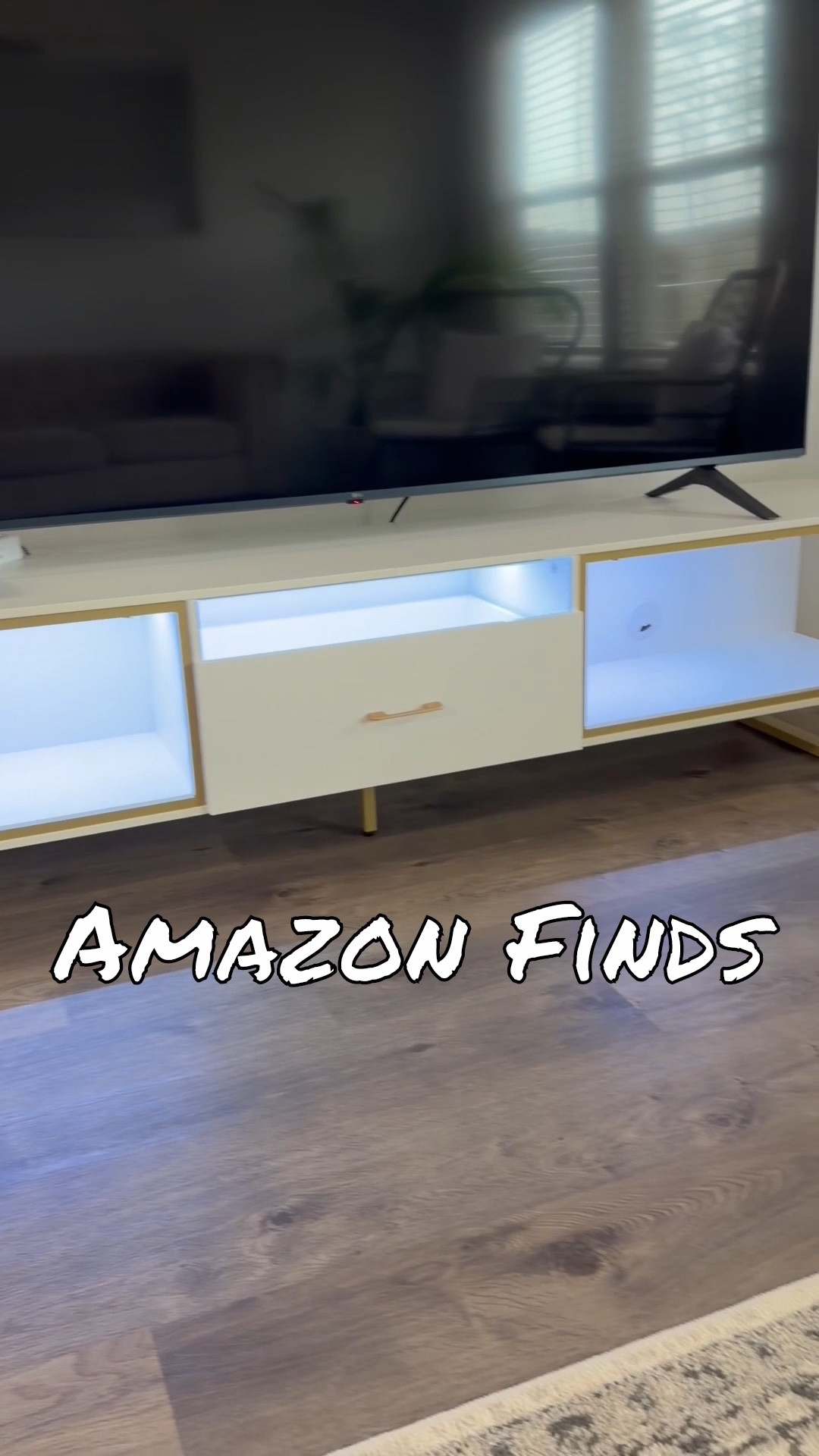 Obsessed with this modern TV stand moment 🤍✨ The white + gold combo looks so luxe and the LED lighting is such a vibe at night. Tons of storage without looking bulky!
#LTKhome #LTKdecor #livingroomstyle #modernlivingroom #homedecorfinds #tvstanddecor #homeaesthetic #amazonhome #whiteandgold #homegoals #homestyling #interiorinspo #storagesolutions #vibyliving #entertainmentcenter 

#LTKstorytime #LTKHome #LTKSaleAlert