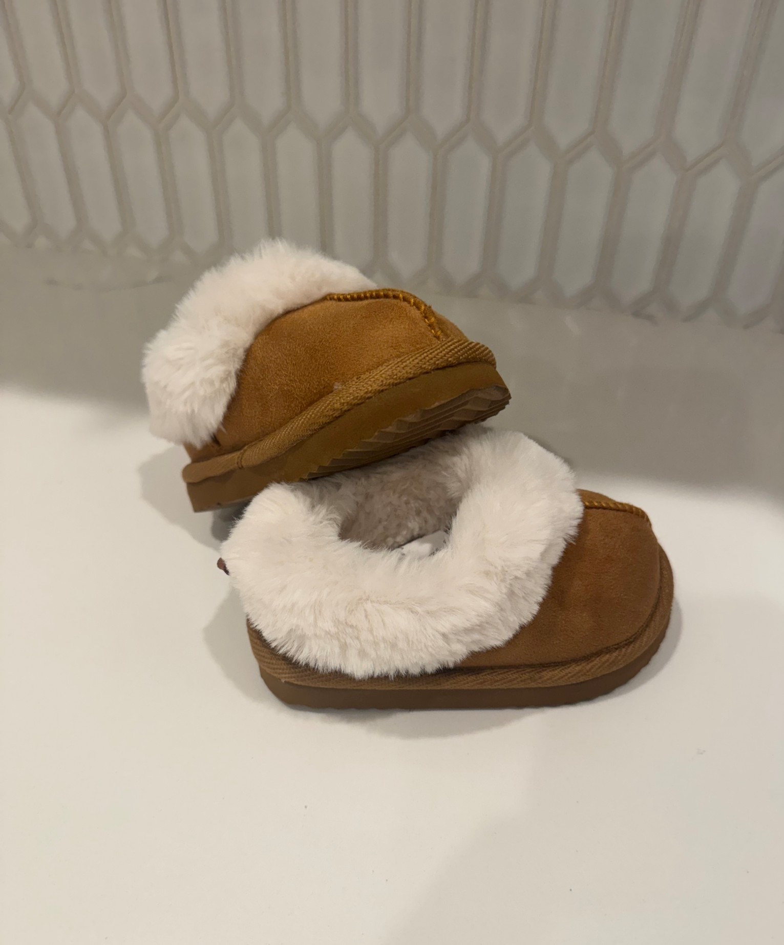 grabbed these little slippers that I saw for my toddler. they literally look like Uggs and match some of mine. she’s at the age where shoes get dirty easily, I don’t know how much she’ll wear them, etc so $13 is much better than $50+. would make a great gift or stocking stuffer #toddlerslippers #comfy 

#LTKFindsUnder50 #LTKKids #LTKBaby
