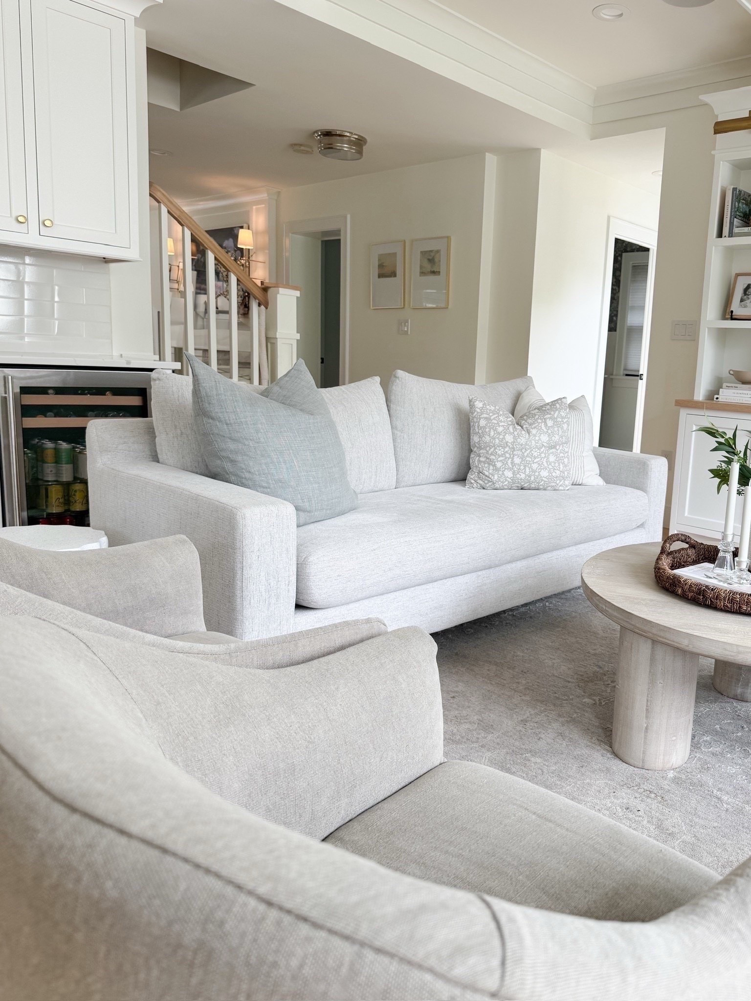 Neutral living room, styling, neutral, living room, light, gray, slipcovered, accent chairs, modern coastal, round, weight, washed coffee table, media center, white TV stand, frame TV, shelf styling 


#LTKHome