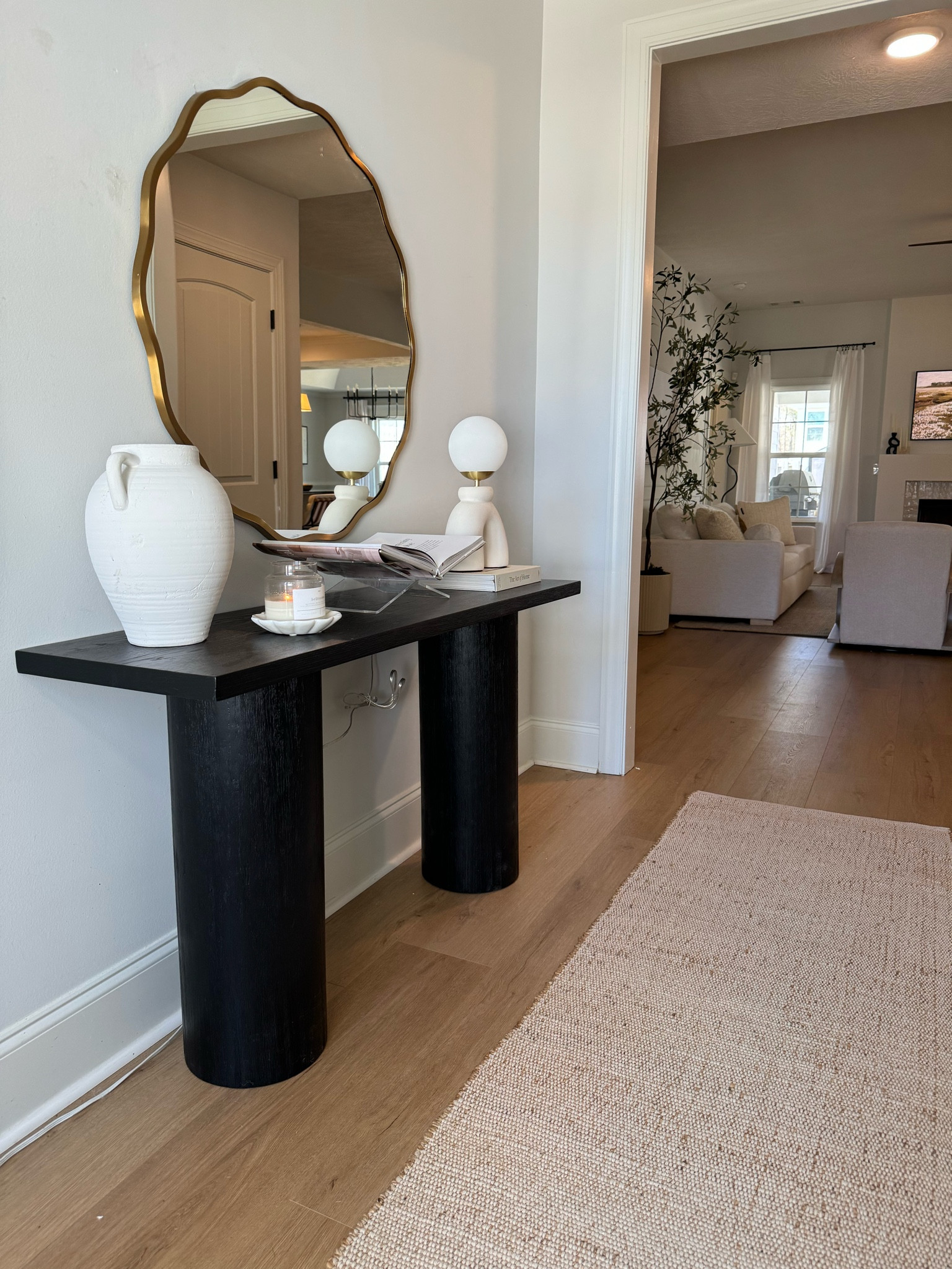 Organic modern entryway inspo! 🤎

Wavy mirror, console table, black console table, organic modern lamp, affordable lamp, jute runner, no shed jute blend rug, candle, affordable decor, affordable console table decor 

#LTKHome