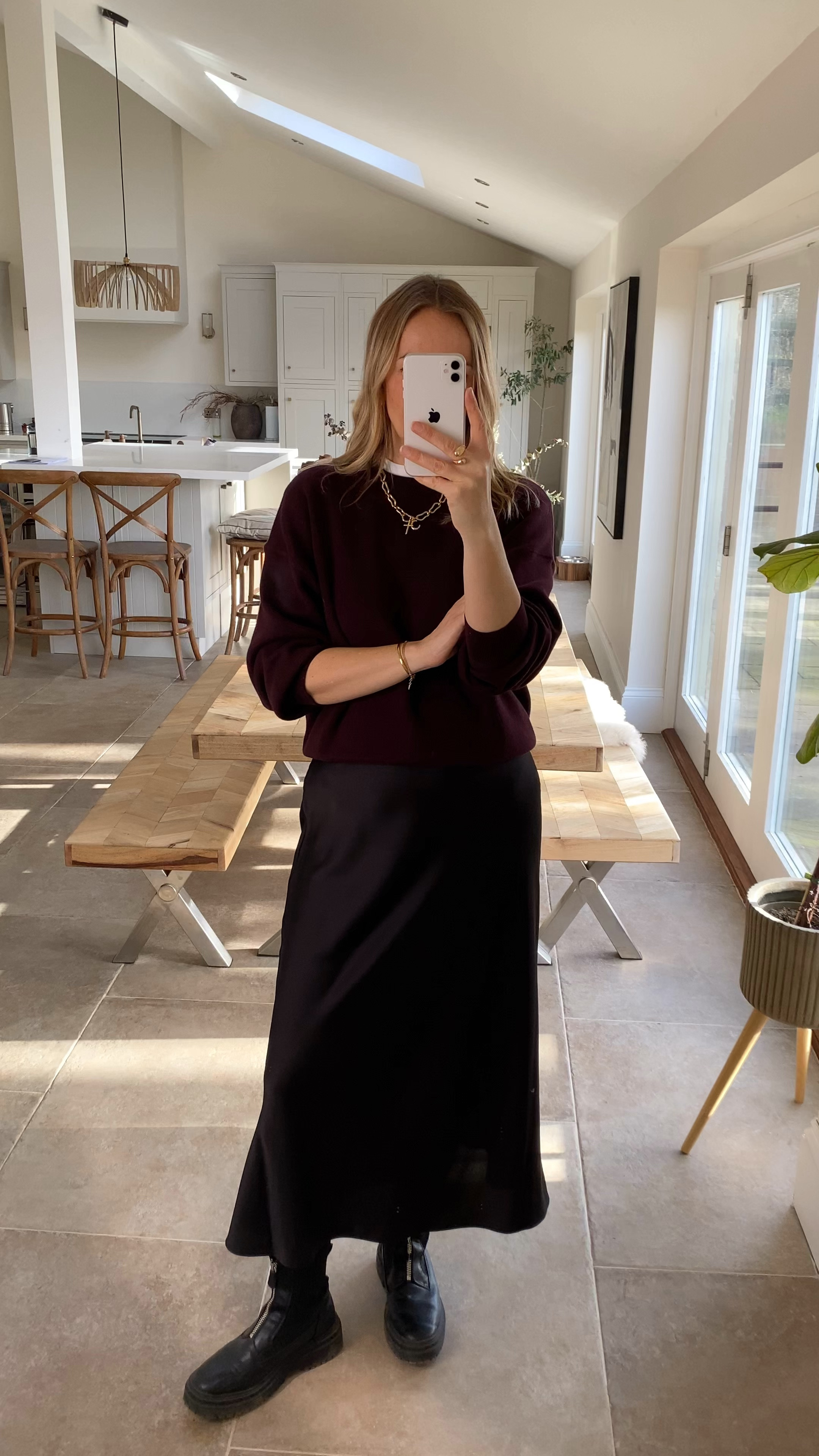 Switching the jeans for that satin skirt 
Burgundy and black work nicely together . 
Wearing a large in the knit 
Large in the skirt 
Medium in the t shirt 

#LTKuk #LTKwinter #LTKstyletip