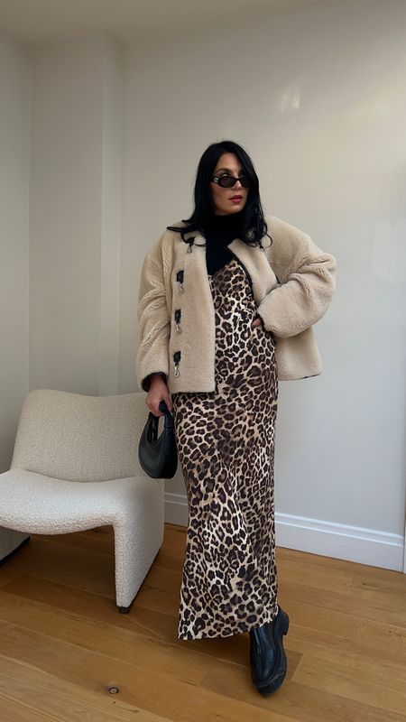 How to wear a leopard print dress
3. Layer a black turtleneck body under the dress and wear with a shearling jacket for casual date night
Toteme shearling jacket + black turtleneck body + leopard print dress + The Row zip boots + black bag

#LTKstyletip #LTKfindsunder100 #LTKSeasonal