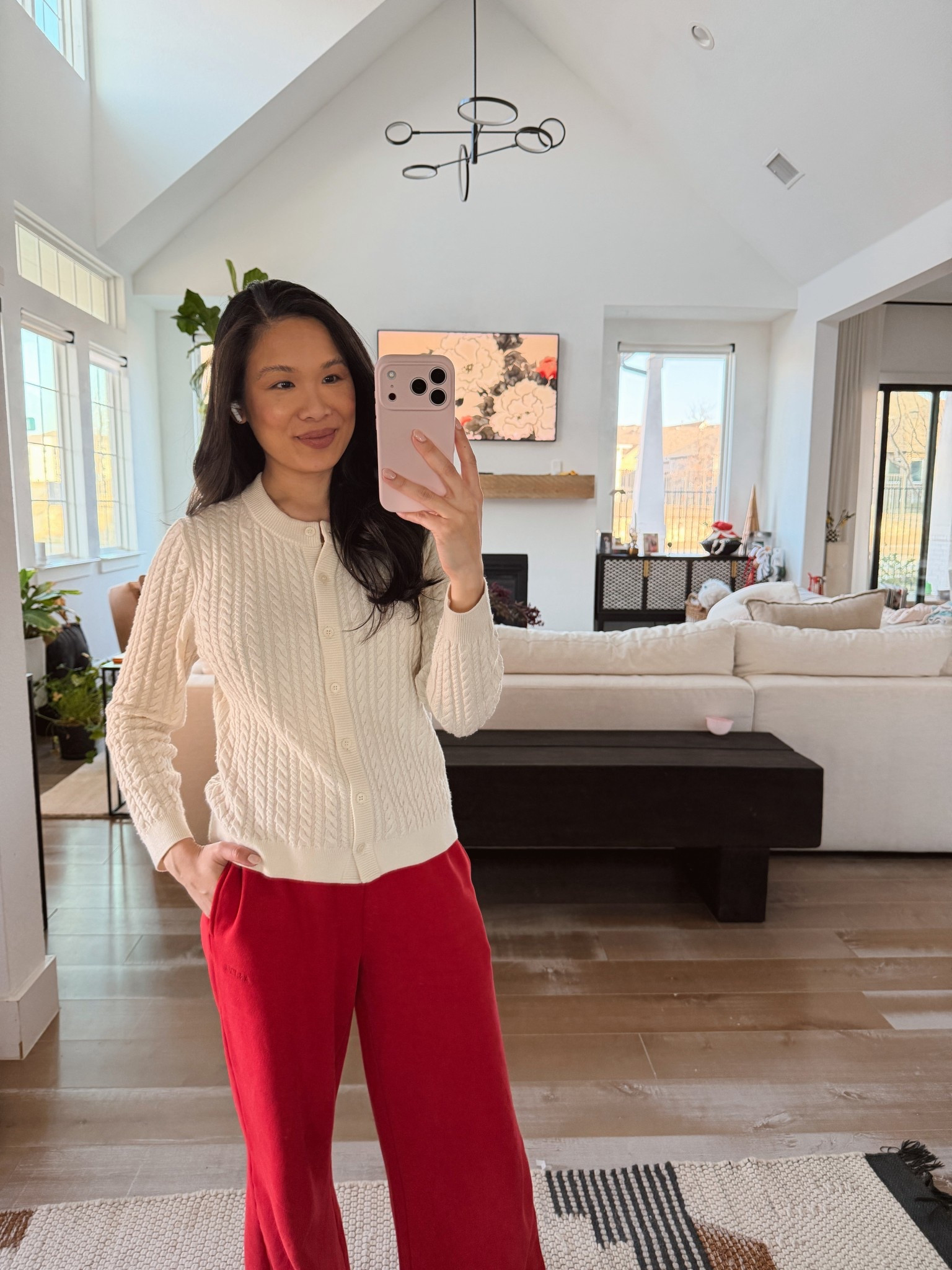 Cable knit merino wool cardigan on sale for almost 40% off styled with red sweatpants for a chic and cozy winter look! Perfect for casual days and is nursing friendly 

#LTKSaleAlert #LTKSeasonal #LTKootd