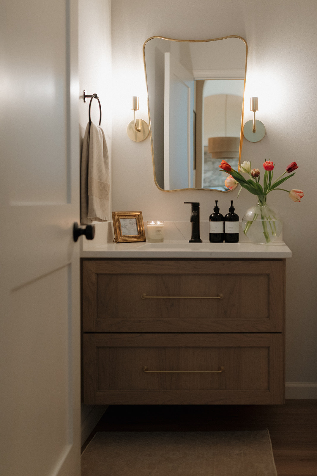 Shop everything in our powder room! // Wall Color: First Star by Sherwin Williams // Flooring: Coretec LVP in Springfield Oak // Cabinets: Custom by Countryside Cabinets in North Pier 

 #LTKHome