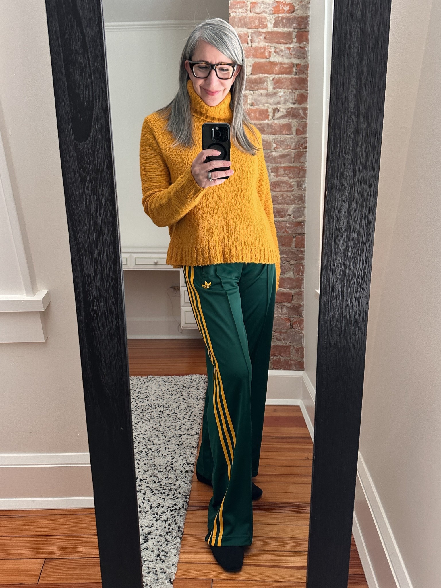 #ComfortableGirlWinter - Track Pants = Real Pants

We typically think of track pants as loungewear. But if the silhouette is right, they're exactly like wide-leg pants.

This pair leans sporty, but the shape is classic. So I styled them the same way I would any wide-leg trouser: a chunky turtleneck in a strong color, suede Mary Janes, and nothing fussy.

When you stop "dressing down" certain pieces, your closet opens up.

Same comfort. More range.
.
.
.
.
##Over60Style #StyleOver60 #EverydayStyle #ModernStyle
