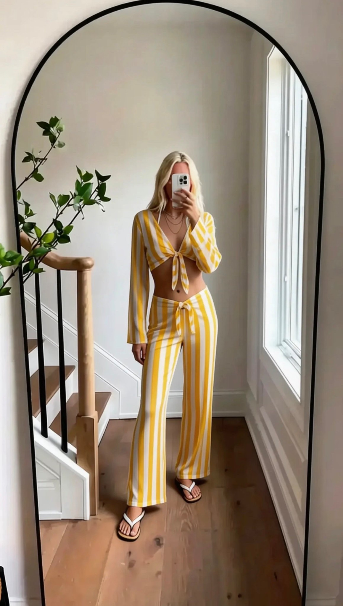 sunlit minimal mirror selfie / coastal chic energy / yellow stripe set / effortless summer glow / clean girl aesthetic / neutral home backdrop / soft natural light / relaxed luxury vibes

Words ( / style ):
summer/effortless/coastal/chic/minimal/sunlit/clean/soft/feminine/fresh/light/airy/modern/polished/relaxed/vacation-ready/golden-hour/simple/elevated

Hashtags:
#SoraStyle #CleanGirlAesthetic #CoastalChic #SummerOutfit #NeutralAesthetic #MinimalStyle #EffortlessStyle #VacationVibes #OOTDInspo #LightAndAiry #ChicLook #StyleInspo #MirrorSelfie #SoftAesthetic #TrendyLooks