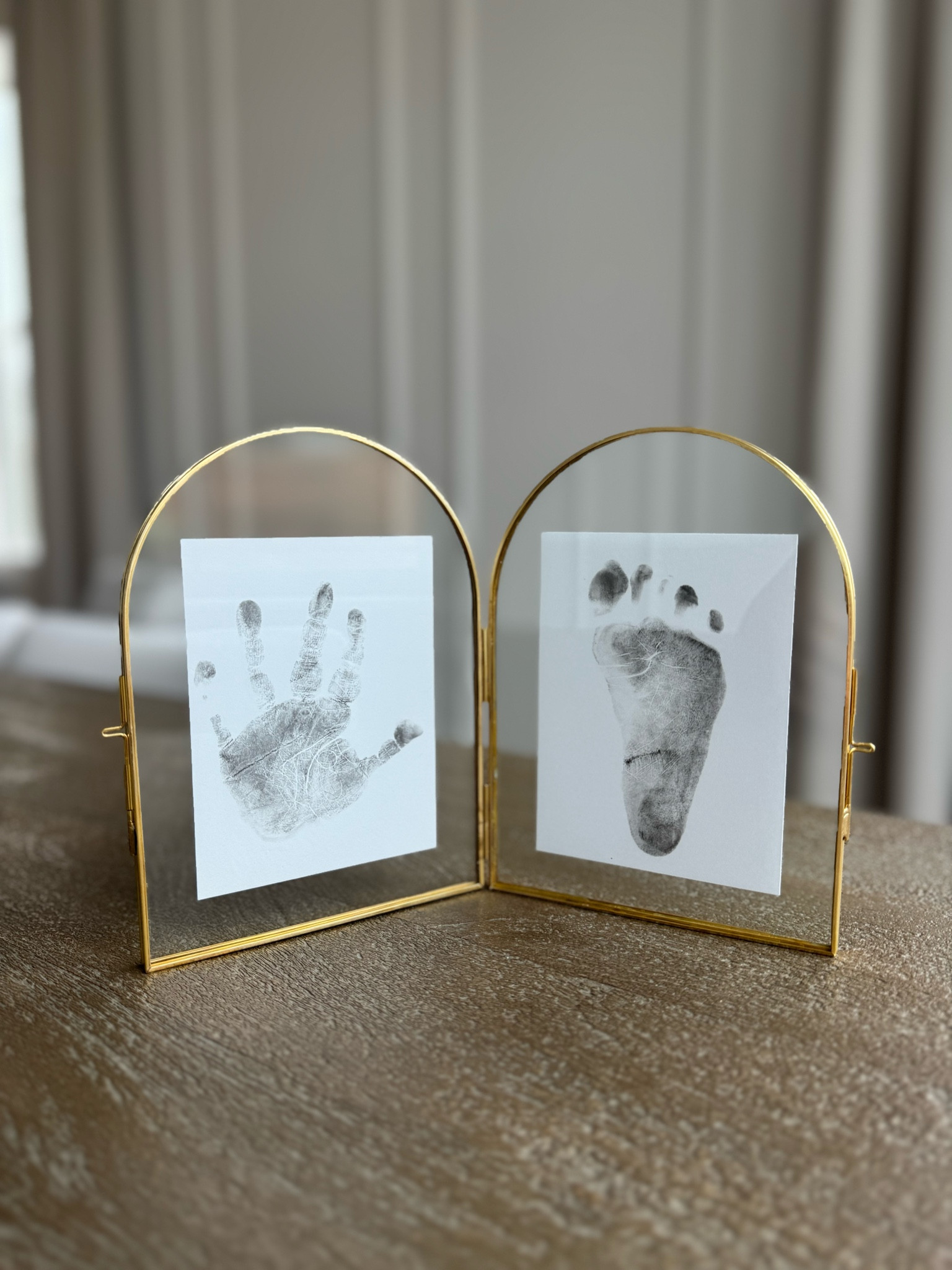 I finally got around to doing a hand and foot print for our baby girl. Framed these in this beautiful arched brass frame. This frame comes in black too! Love how this turned out so much, might do another one with my dog's paw print next 🐾
