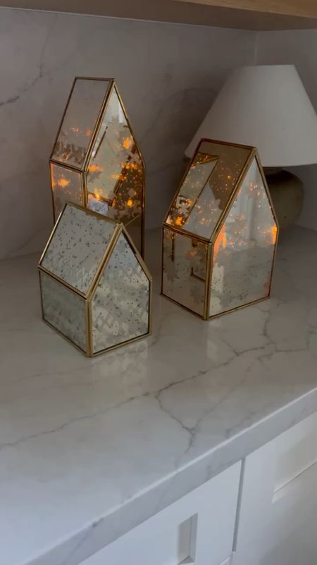 Mercury glass houses with a fair isle pattern.  You can put a strand of lights or candle inside to make it glow. 

#LTKHoliday