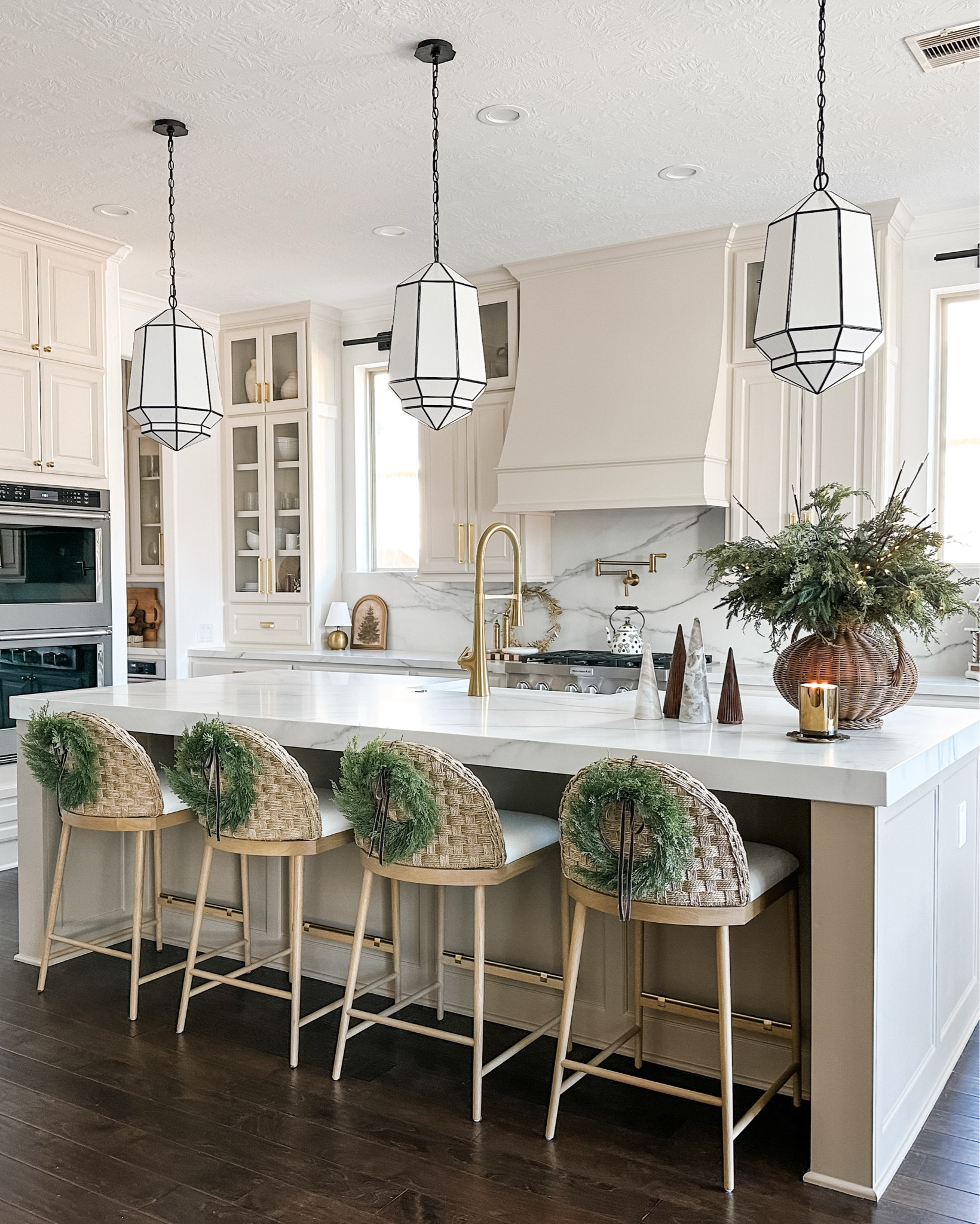 My holiday decor in my kitchen. I kept in simple this year. Some Norfolk greenery, mini wreaths for the back of the counter stools, and a couple more
Touches and I call it complete. Everything you see here is linked 

#LTKHoliday #LTKSeasonal #LTKHome