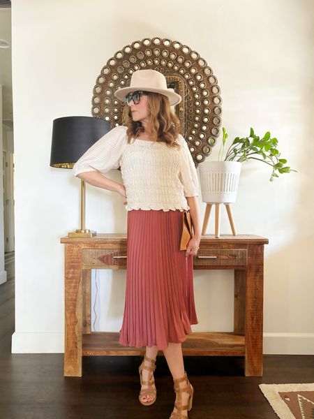 Styling this pleated skirt with a smocked top and gladiator sandals to take it into spring.  This skirt has an elastic waist!  

#LTKover40 #LTKfindsunder100 #LTKSeasonal