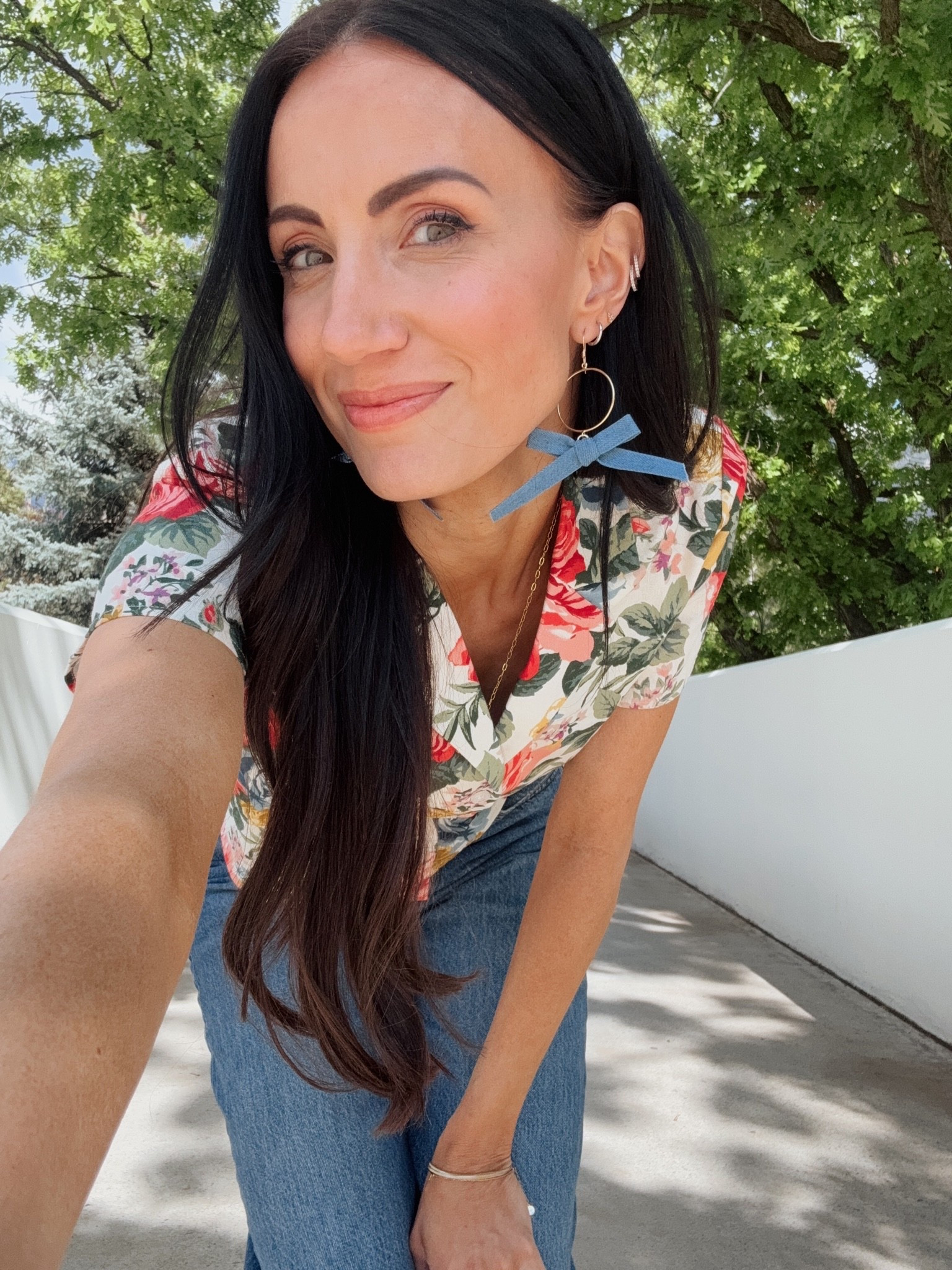 This top is such a pretty print. Tts. Pared with denim bow statement earrings. Love.