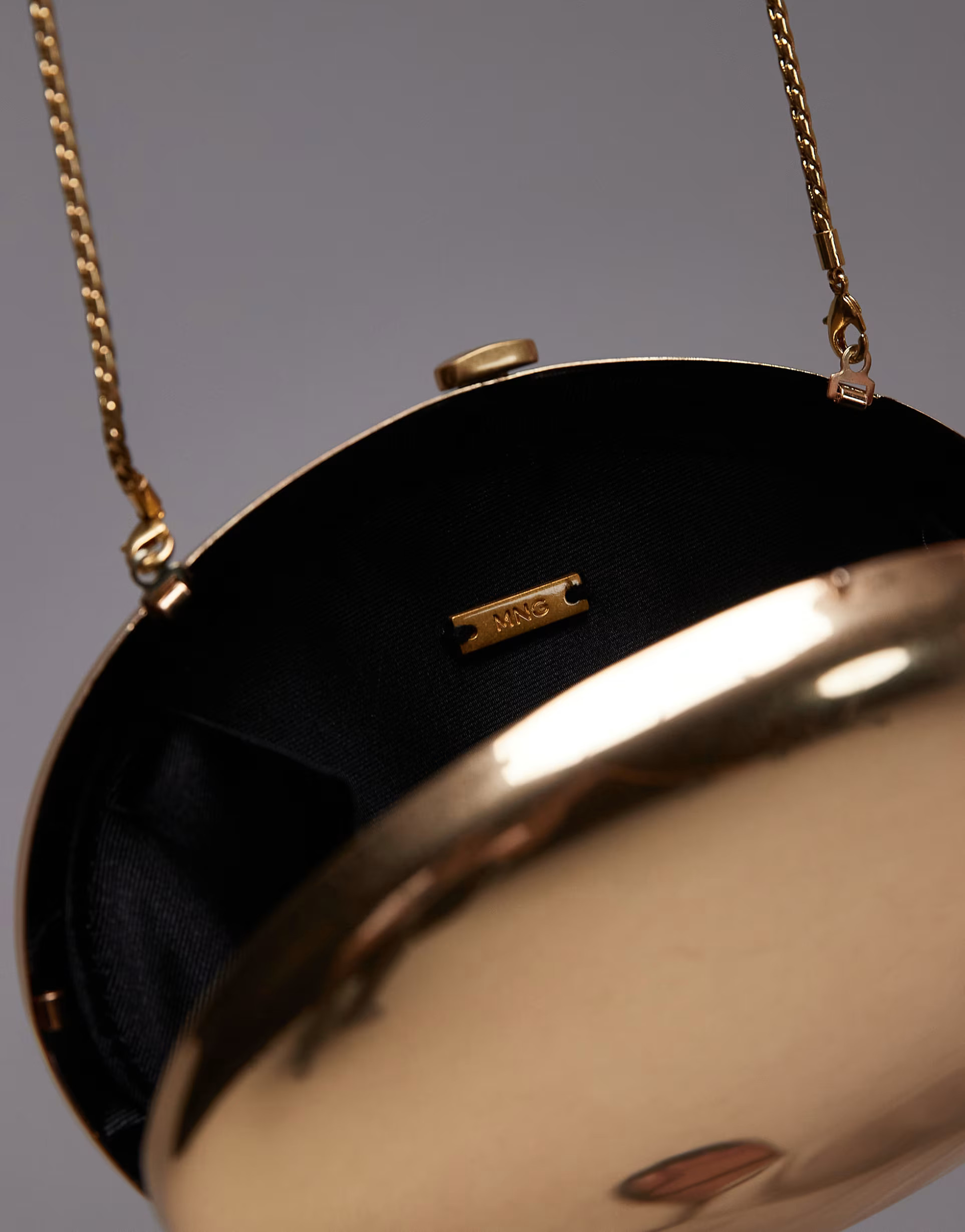 Mango oval metal clutch bag in gold | ASOS (Global)