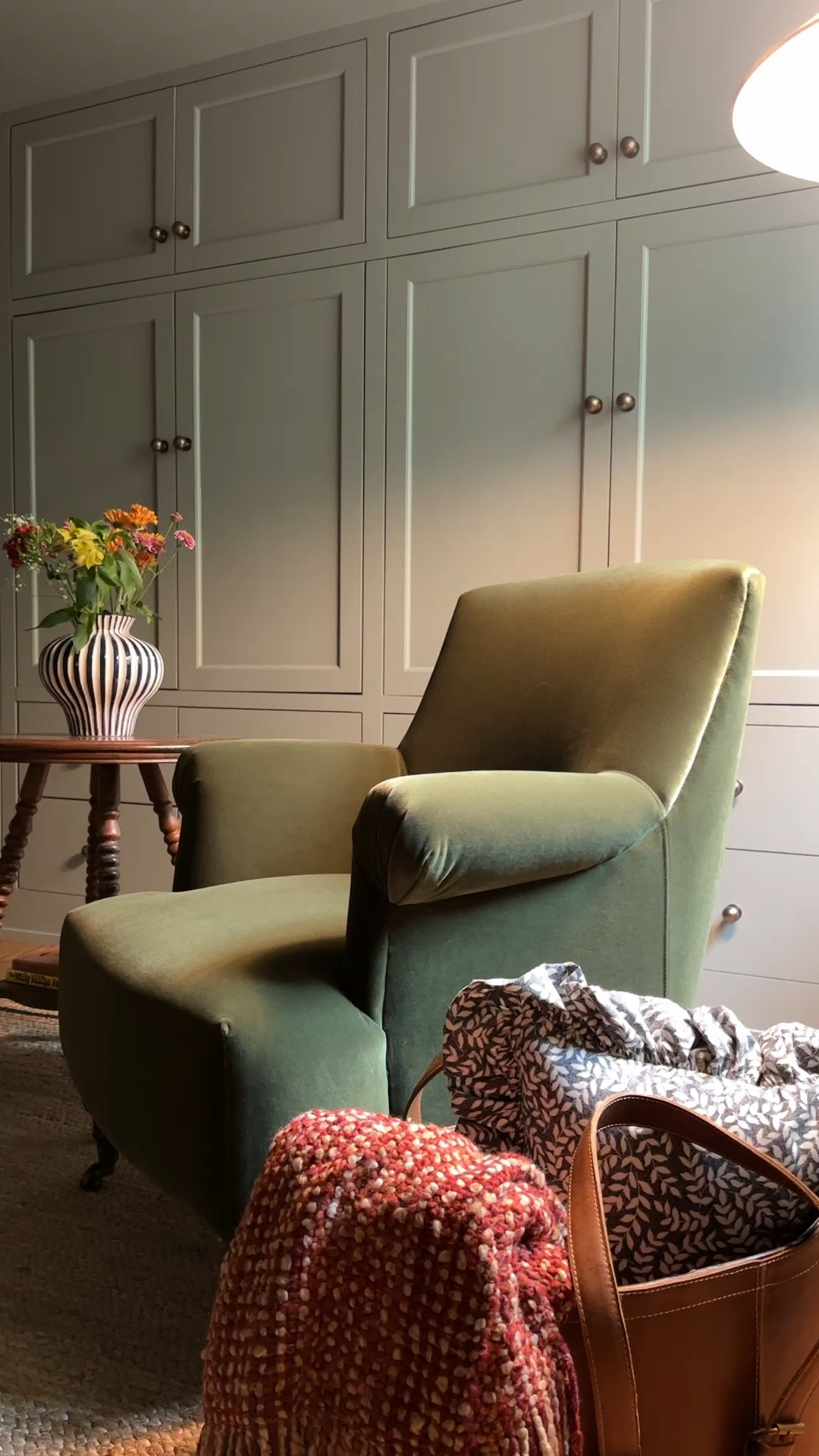 A touch of fall vibes with @birchlane. This work-from-home station is extra cozy with the green upholstered arm chair (on sale!), scalloped rug, leather tote as basket, ruffled pillow, floor lamp, woven throw and striped vase. The table is a second hand find but linking something similar. #birchlanepartner  #mybirchlane

#LTKStyleTip #LTKSaleAlert #LTKHome