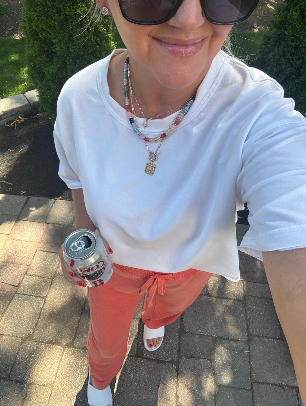 I wore this for an afternoon outside when comfort was the priority, but I still wanted to feel pulled together. The white tee has a relaxed fit, and the coral drawstring pants are lightweight and easy to move in without clinging.

white tee outfit, coral pants, drawstring pants, casual summer outfit, lightweight clothing, comfortable style, colorful summer look, weekend outfit, everyday fashion, lovelylifestyling

#LTKootd #LTKOver40 #LTKSeasonal