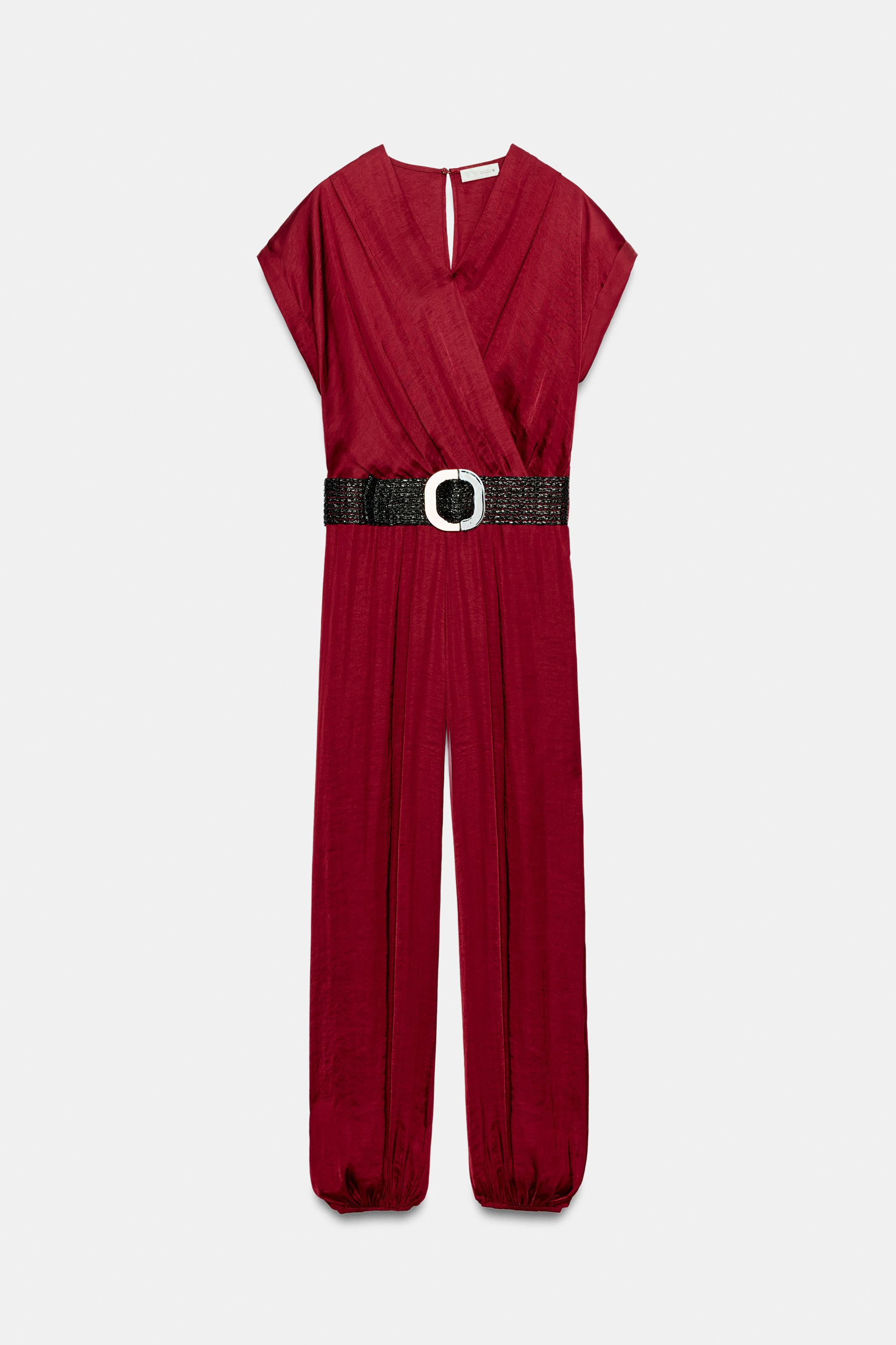 V-neck wrap jumpsuit with short sleeves. Features an elasticized waist and belt. Side pockets hid... | Zara US