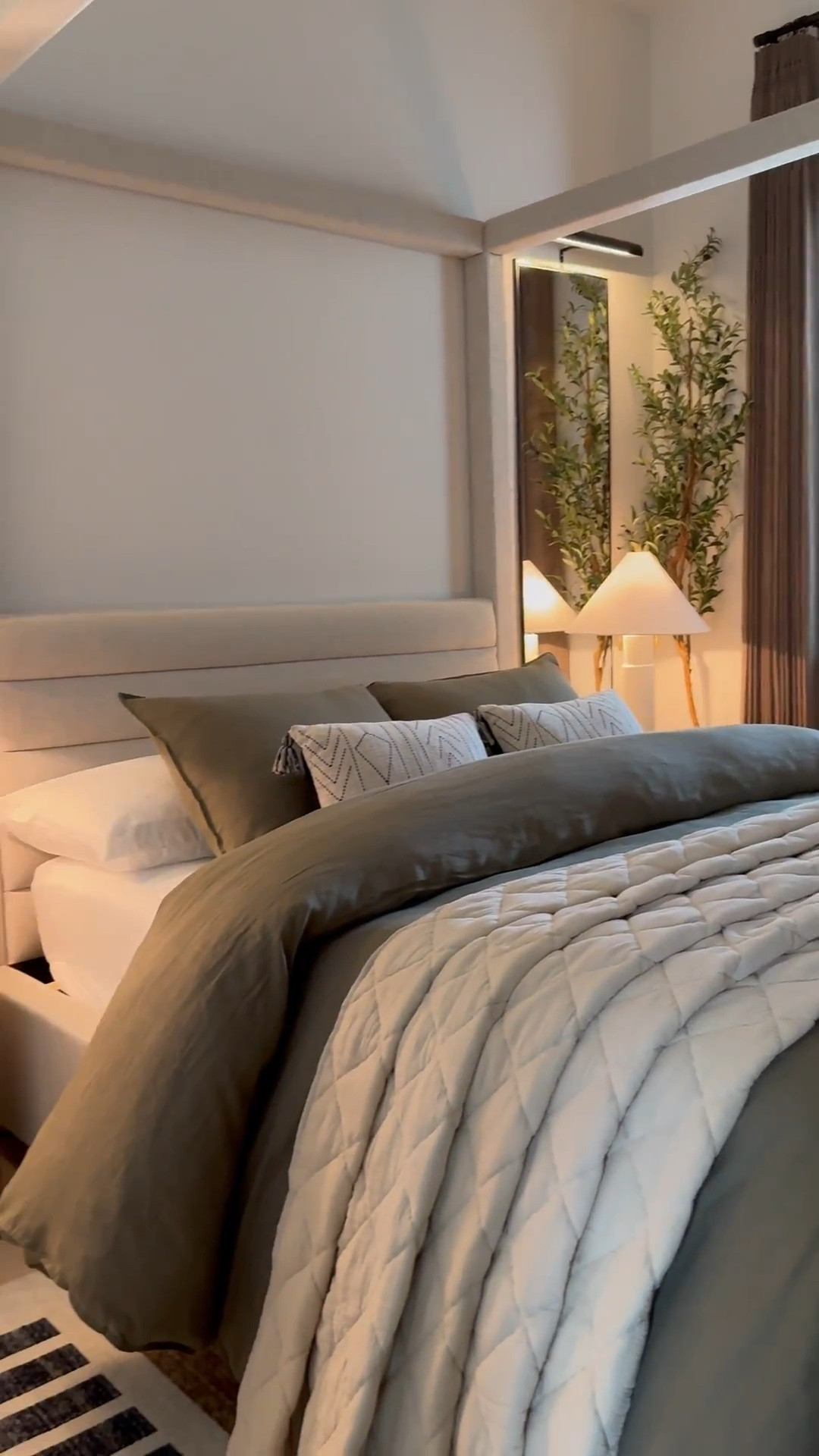 I used two duvet inserts to create that fluffy look.. plus i added a throw blanket under the rolled part! 🤎 Bed size is a Queen and the duvet+inserts are King size. I like sizing up on bedding bc it gives more fabric to work with especially if you want your bed to look full around! 😊

Measurements: 

Bed: Queen 

Duvet: King size - I inserted 2 King sized down inserts to give the bed a fuller look. Sheets & pillows are Queen sized 

Mirrors - 58" H x 18" W……mirrors will make your space feel larger as well as reflect light to other parts of the room! 

Drapes: Color Cafe Brown … Size 40"W x 108" W 

Sideboard in front of the bed was bought internationally but I linked a similar one below - Great price too!! 🤎

I used the “small table lamp” (linked) to create the glow effect behind the planter. I recommend  warm white light bulbs 😊

#LTKHome #LTKSaleAlert #LTKStyleTip