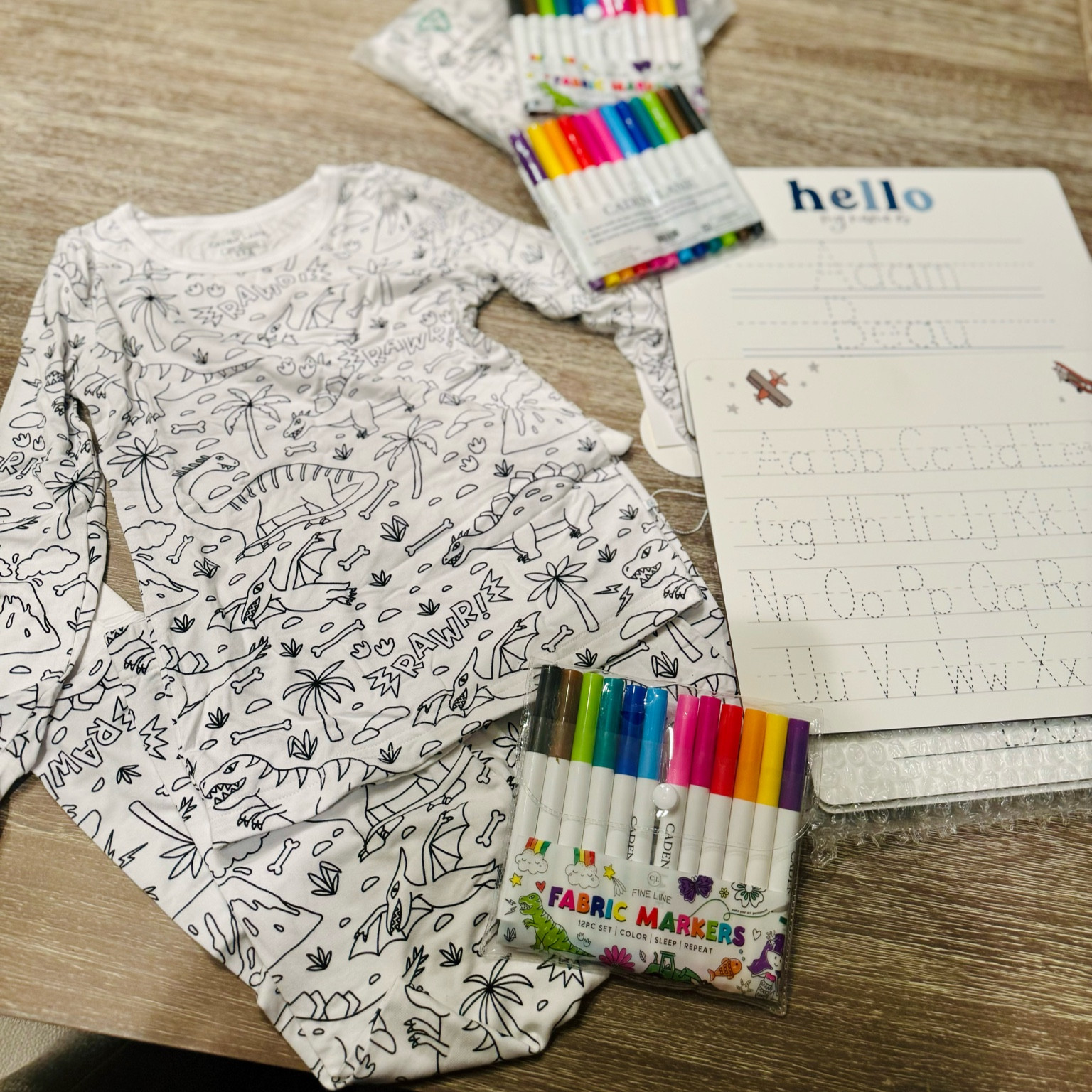 Cutest gifts for kids! Super soft bamboo pjs with fabric markers from Caden Lane. We’ve had color your own pjs before, and they have been pretty stiff and scratchy, but these are actually pjs my kids will love to wear! The white boards are so cute for preschoolers or kindergartners trying to perfect their letters and name. I’m a big fan of gifts that are not just fun, but practical! 

#LTKCyberWeek #LTKGiftGuide #LTKKids