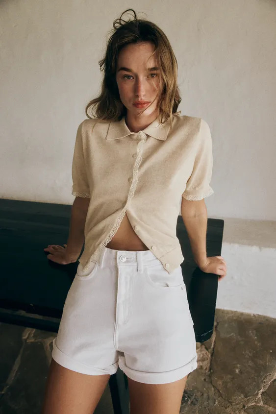 Polo neck, short-sleeve cardigan. Finished with lace trim. Front button closure. | Zara US