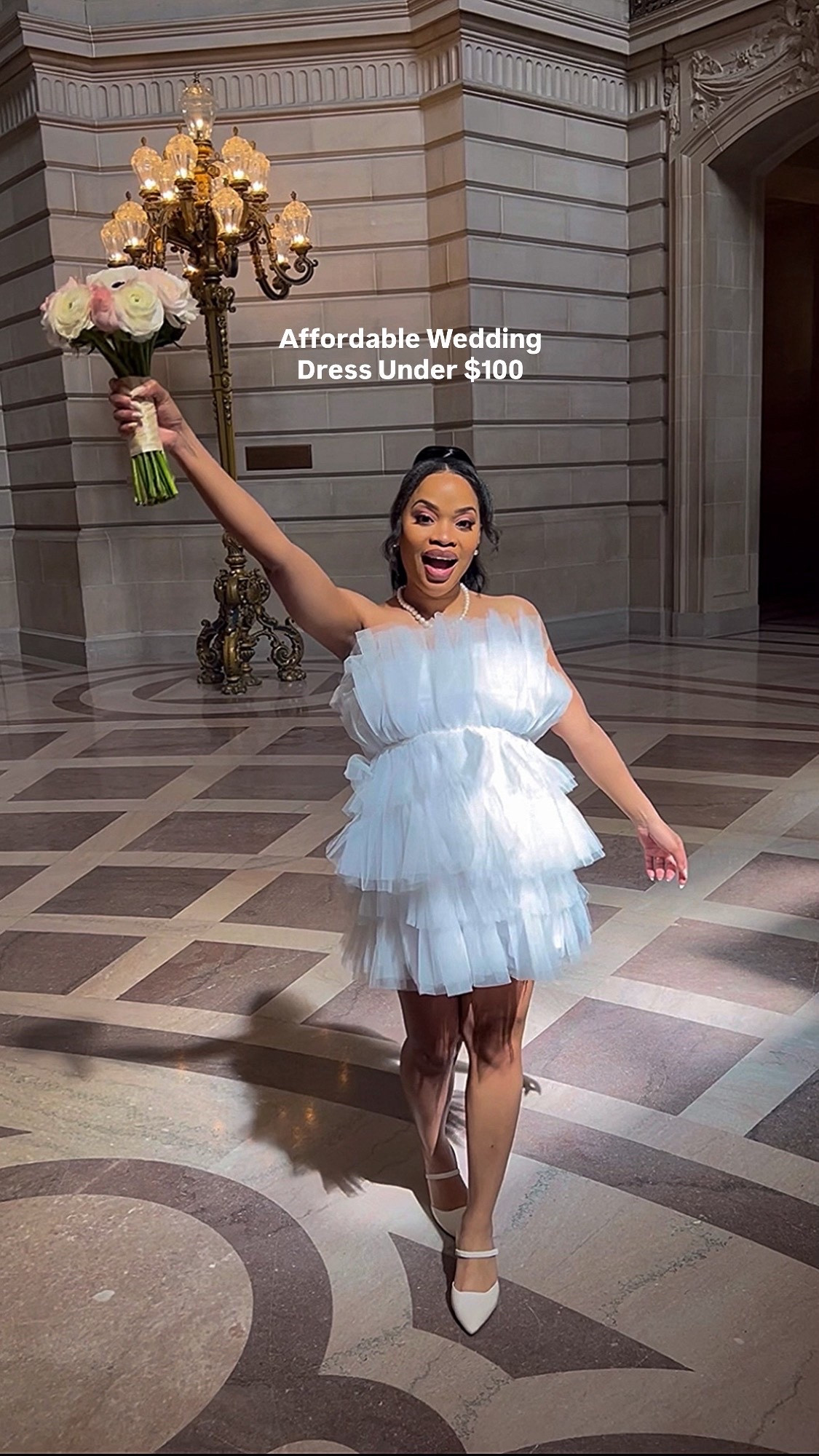 This entire bridal look is from Lulus and I still can’t get over how affordable it is.

The wedding dress is under $100 and perfect for a courthouse or city hall wedding, rehearsal dinner, engagement photos, or bridal shower. It’s lightweight, flattering, and looks way more expensive than it is.

I paired it with classic off white pointed toe mules from Lulus that give the same clean, bridal look and are easy to rewear after the wedding.

If you’re a bride on a budget but still want a chic, timeless wedding look, everything is linked here 🤍

#LTKPetite #LTKFindsUnder100 #LTKWedding