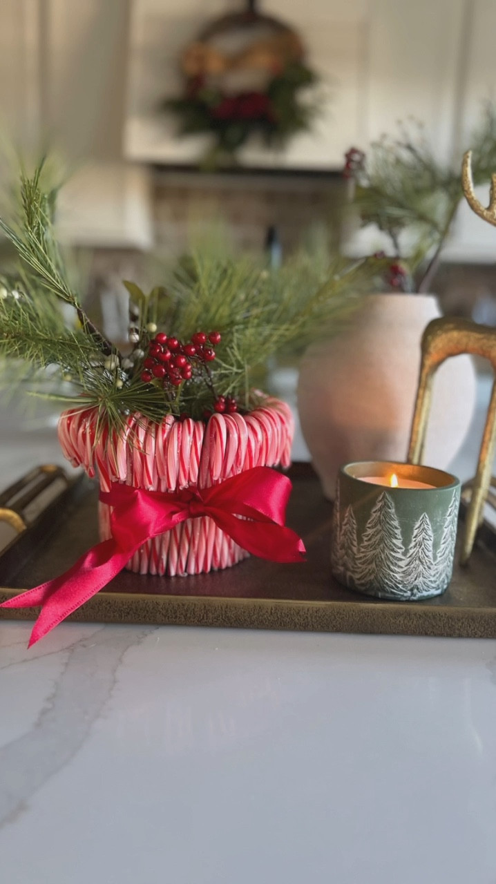Sharing a beautiful candy cane DIY centerpiece that’s so easy to recreate. I kept the candy canes in the original clear wrapping and can be presented as a hostess gift with a gift card attached. Most of the supplies can be found at the dollar store for a real affordable holiday craft. 

#LTKHoliday #LTKHome #LTKVideo