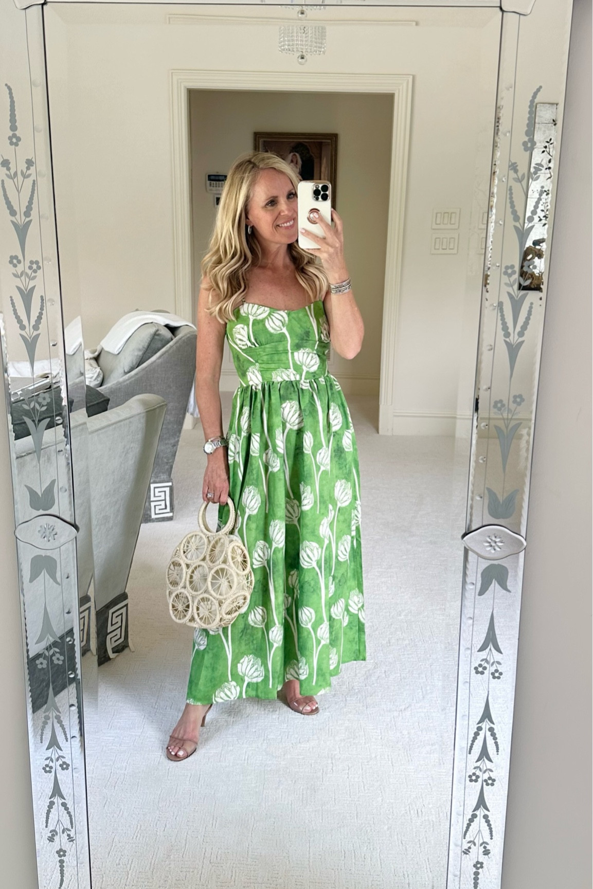 Beautiful green and white floral patterned maxi dress paired with a basket handbag and nude strappy heels 

#LTKstyletip #LTKSeasonal #LTKshoecrush
