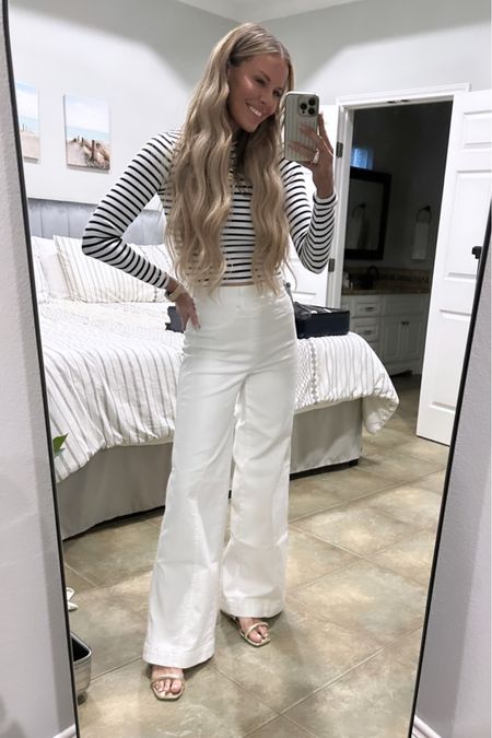 The simplest combination for spring & summer: stripes & white! When pairing wide leg jeans with a top, always think about balancing the silhouettes & pair them with a slim fitting top….or vice versa! This top is only $15 & I’m wearing a small // use my spanx code COURTXSPANX for 10% off these white wide leg jeans..wearing a small in the regular length! 

#LTKunder50 #LTKstyletip #LTKSeasonal
