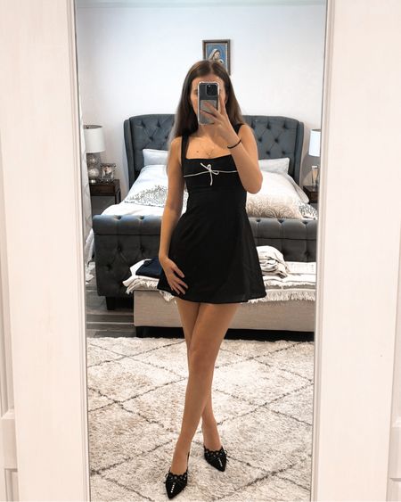 A black mini dress paired with heeled mules makes a classy spring outfit. 
.
.
.
.
.
.
Spring dress | spring outfits | spring shoes | black dress | dinner dress | date night outfit | date night dress | summer dresses | line dress | classy outfit | European summer outfits | brunch outfit | old money outfits | Spring heels | amazing finds | kitten heels shoes | trendy shoes | black heels | summer heels |  bow heels | comfortable heels | black closed toe heels | black mules | heeled mules | 

#LTKGiftGuide #LTKSeasonal #LTKFestive #LTKFind #LTKunder50 #LTKunder100 #LTKU #LTKsalealert #LTKfindsunder50 #LTKfindsunder100 #LTKstyletip #LTKworkwear #LTKtravel #LTKshoecrush #LTKitbag #LTKparties