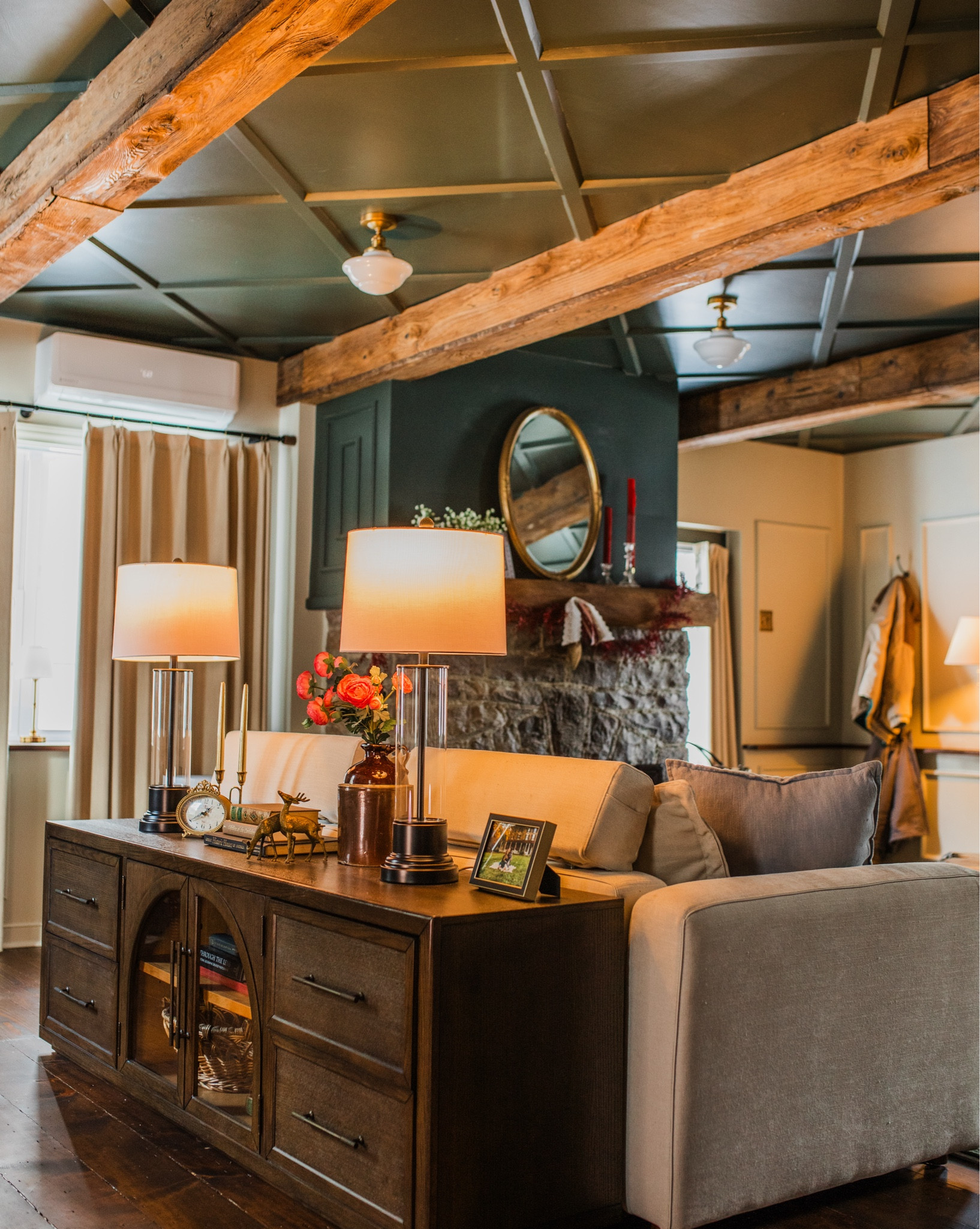 A few of my most-used pieces from our den. The console table anchors the layout, the lamps add soft, functional lighting, and the faux florals keep the space from feeling too heavy. All classic, versatile pieces we use daily. #lighting #livingroomdecor

#LTKU #LTKHome