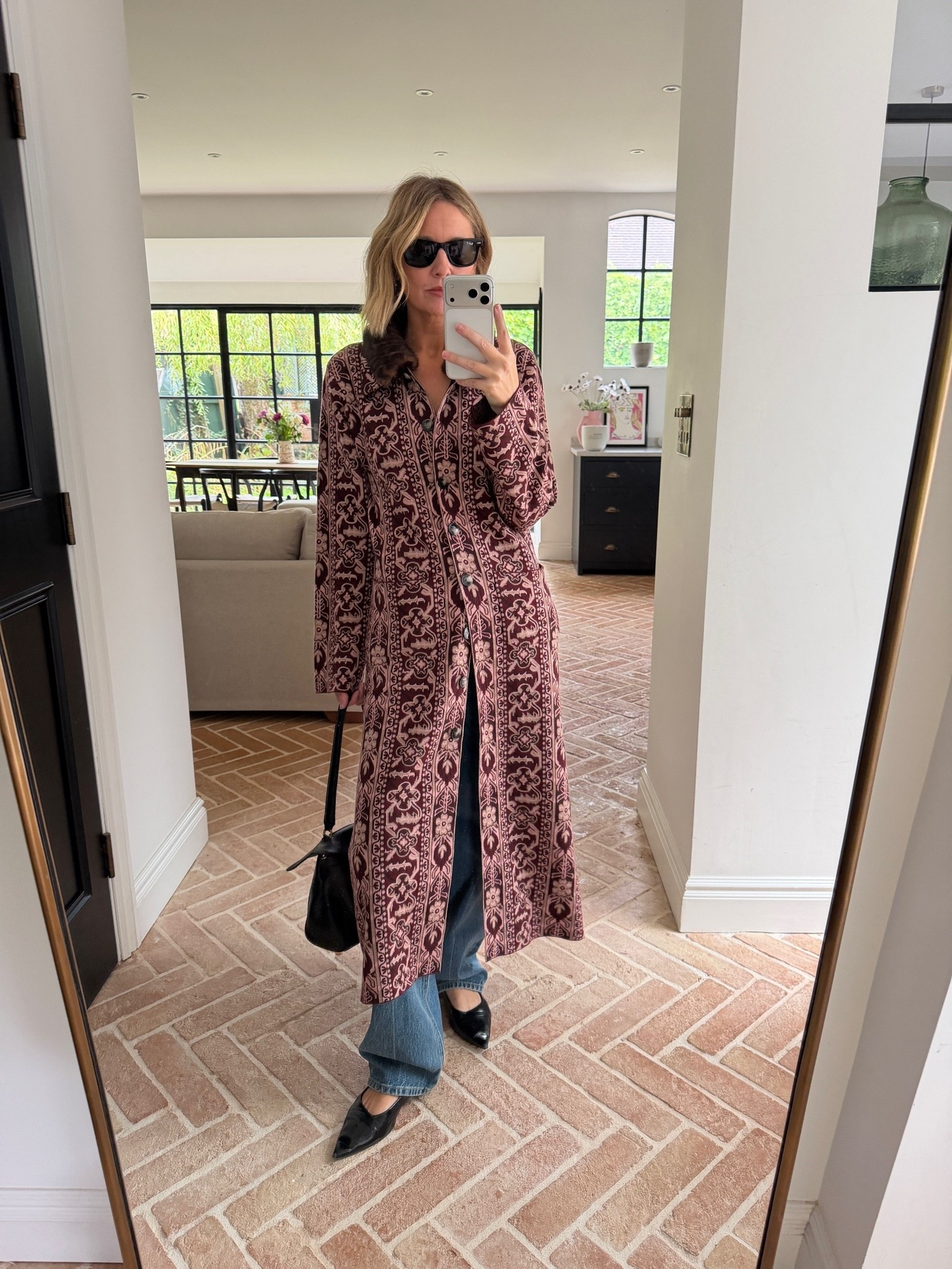 This coat 🖤

longline printed coat, button front duster coat, patterned maxi coat, fur collar coat, statement outerwear, tapestry print coat, wide leg denim, straight leg jeans, black pointed toe flats, black shoulder bag, black cat eye sunglasses, autumn transitional dressing, layered outfit, elevated basics, quiet luxury, statement print, mirror selfie ootd, ltkstyletip, ltkseasonal, ltkfindsunder100, ltkitbag

#LTKdatenight #LTKpartywear #LTKstyletip