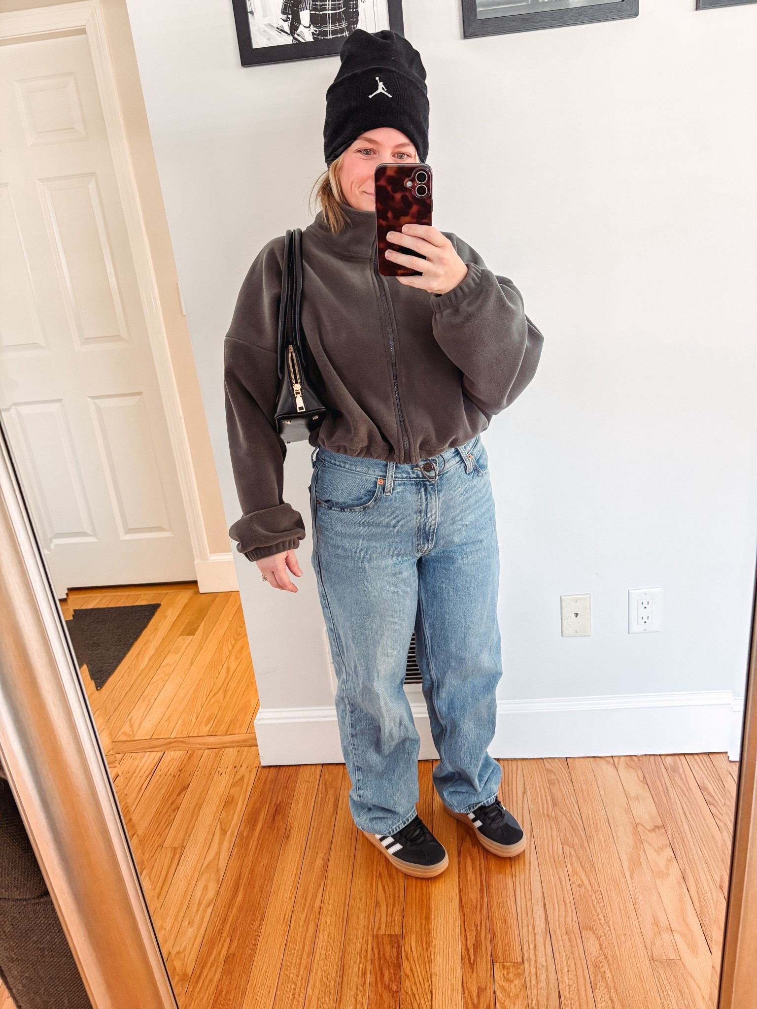 Croppped Amazon fleece funnel neck zip up: wearing S 
Black sambas 
Jordan silk lined beanie 
Dad jeans Levi’s 
Melie Bianco Dakota bag 