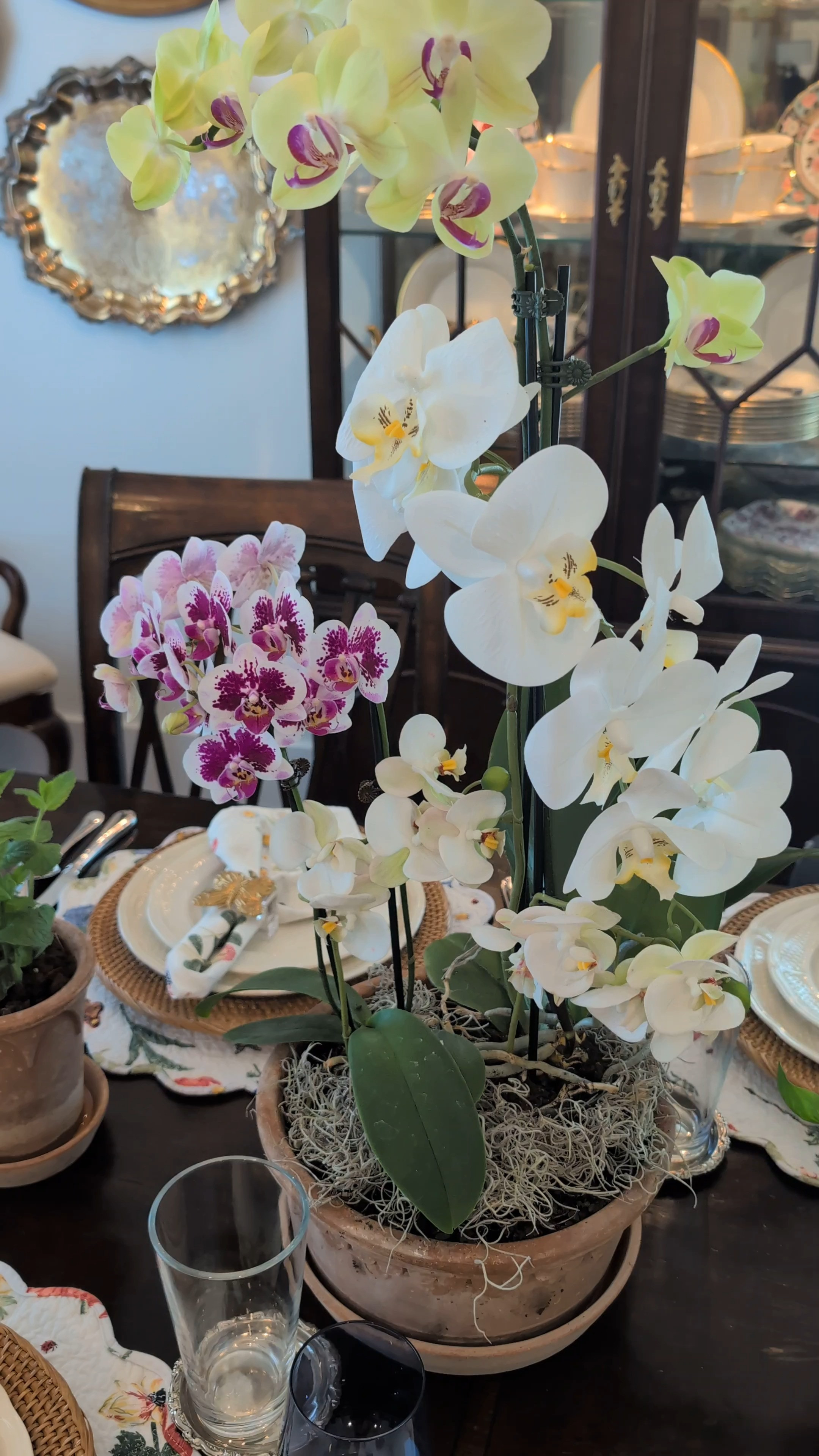 These artificial orchid stems will become your greatest home hack! I clip them up alongside the real stems that have lost their blooms and no one knows! 
#HomeHack #OrchidHack #CenterpieceIdea  

 #LTKHome #LTKSaleAlert