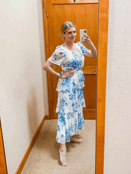 Flowy white and blue dress I bought for our mommy and me photo shoot with my son. I will also be wearing again for Easter! Love that it covers my shoulders and would even be great at a resort vacation for dinner  

#LTKSeasonal #LTKtravel #LTKstyletip