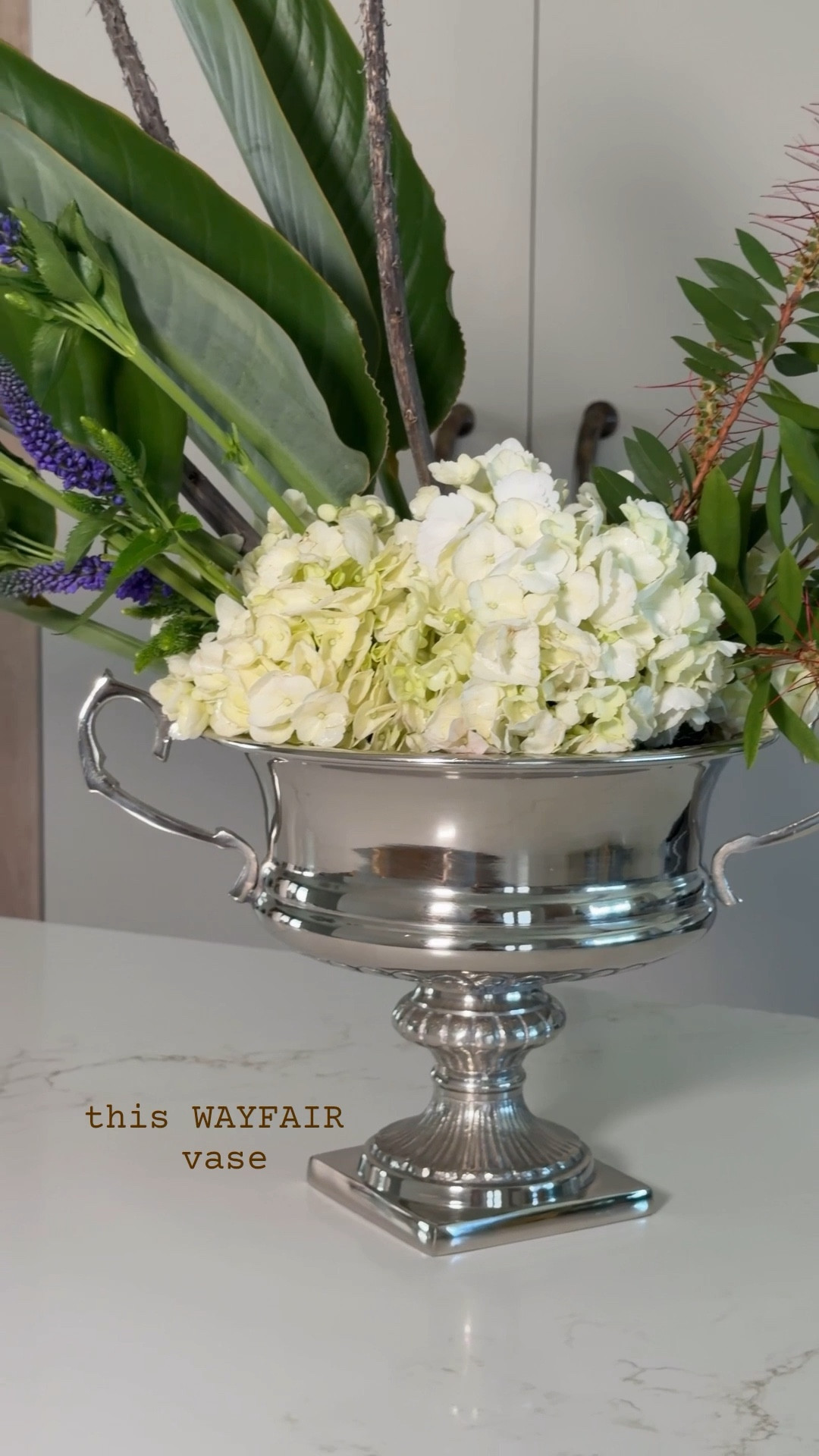 #ad found so many beautiful vases under $100 @Wayfair 💐
decided to make a little DIY floral arrangement for Mother’s Day
fresh florals + decor she can reuse every day just feels more special ✨  
size 8.25” x 13.5” x 10” 
#WayfairPartner #Wayfair #MothersDay

Linking lots of my favorite vases

Spring home
Silver vase 
Chrome vase 
Hand blown vase 
Ceramic vase 
Bud vase 
Glass vase 
Gifts for her 
Home decor 
Wayfair finds 
Mother’s Day gift 



#LTKMothersDay #LTKHome #LTKSeasonal